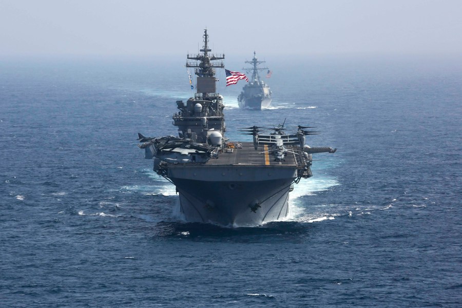 FILE - In this photo released by the U.S. Navy, the amphibious assault ship USS Kearsarge and the Arleigh Burke-class guided-missile destroyer USS Bainbridge sail in formation as part of the USS Abraham Lincoln aircraft carrier strike group in the Arabian Sea. President Joe Biden has chosen Adm. Lisa Franchetti to lead the Navy, a senior administration official said Friday, July 21, 2023. If confirmed, she would be the first woman to be a U.S. military service chief. (Mass Communication Specialist 1st Class Brian M. Wilbur, U.S. Navy via AP, File)