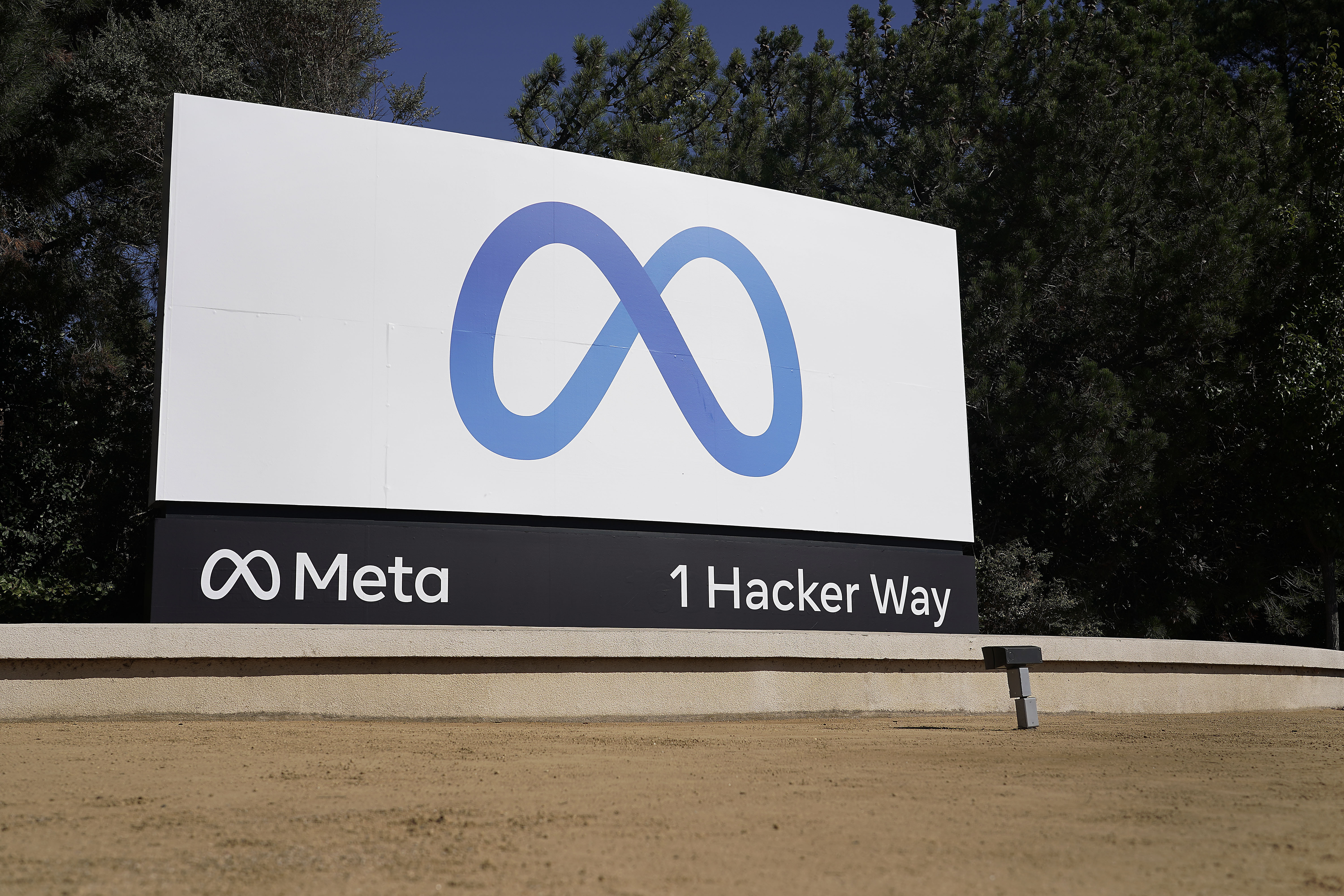 FILE - Facebook's Meta logo sign is seen at the company headquarters in Menlo Park, Calif., Oct. 28, 2021. Meta Platforms reports earnings on Wednesday, July 26, 2023. (AP Photo/Tony Avelar, File)