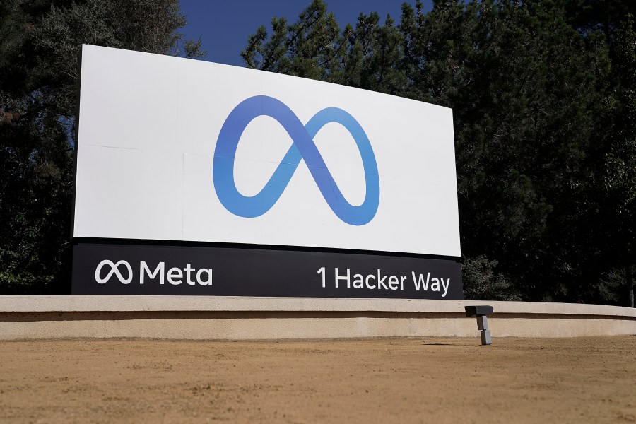 FILE - Facebook's Meta logo sign is seen at the company headquarters in Menlo Park, Calif., Oct. 28, 2021. Meta Platforms reports earnings on Wednesday, July 26, 2023. (AP Photo/Tony Avelar, File)