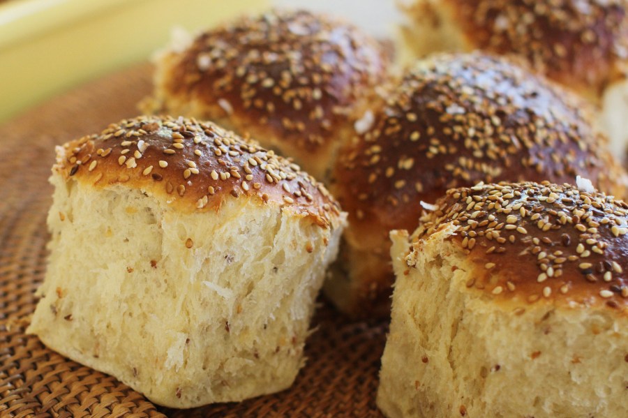 FILE - Sesame dinner rolls sit on a mat in Concord, N.H., on Oct. 12, 2015. Food manufacturers who deliberately add sesame to their products and include it on the labels are not violating a new federal law, the U.S. Food and Drug Administration said Wednesday, July 26, 2023. (AP Photo/Matthew Mead, File)