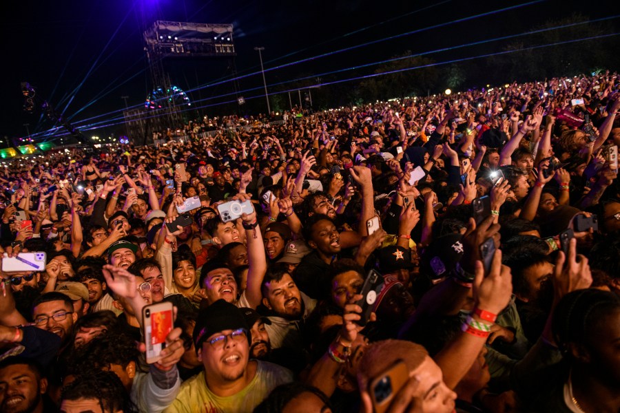 FILE - The crowd watches as Travis Scott performs at Astroworld Festival at NRG park on Friday, Nov. 5, 2021 in Houston. Nearly two years after 10 people were crushed to death during the deadly 2021 Astroworld festival, no charges have been filed despite at least some people, including workers, expressing safety concerns about the event.(Jamaal Ellis/Houston Chronicle via AP, File)