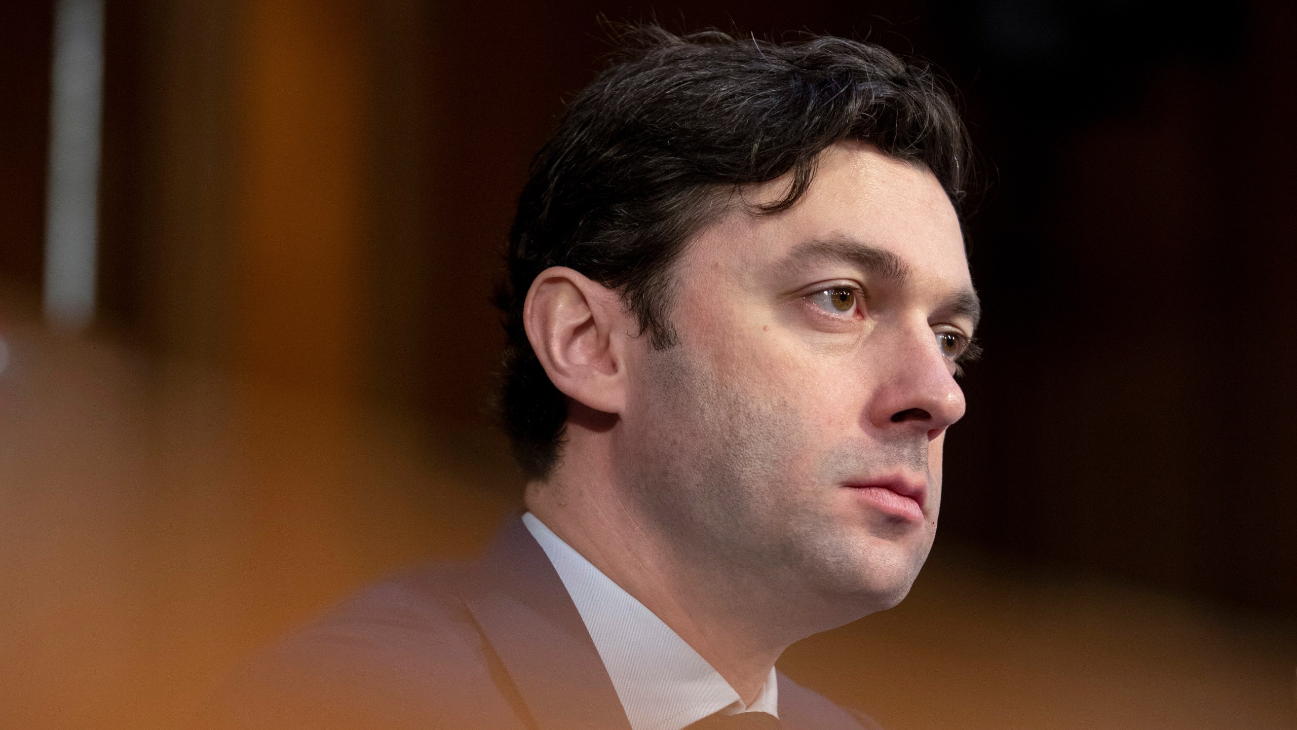 FILE - Sen. Jon Ossoff, D-Ga., listens during a Senate Intelligence Committee hearing to examine worldwide threats at the Capitol in Washington, Wednesday, March 8, 2023. Ossoff sharply questioned Assistant Attorney General Matt Olsen in June about how it searches Section 702 of the Foreign Intelligence Surveillance Act data and signaled he would push for new protections. “I don't think you've effectively made the case that there shouldn't be a warrant requirement, whether or not it is constitutionally required, for a U.S. person search that is crime only,” he said. (AP Photo/Amanda Andrade-Rhoades, File)