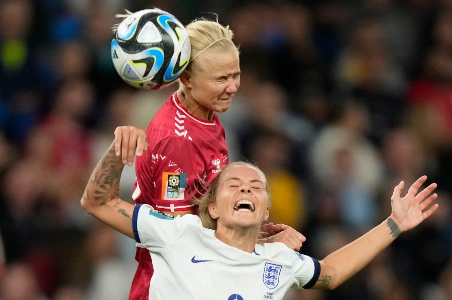 Denmark's Pernille Harder gets above England's Rachel Daly to win a header during the Women's World Cup Group D soccer match between England and Denmark at the Sydney Football Stadium in Sydney, Australia, Friday, July 28, 2023. (AP Photo/Rick Rycroft)