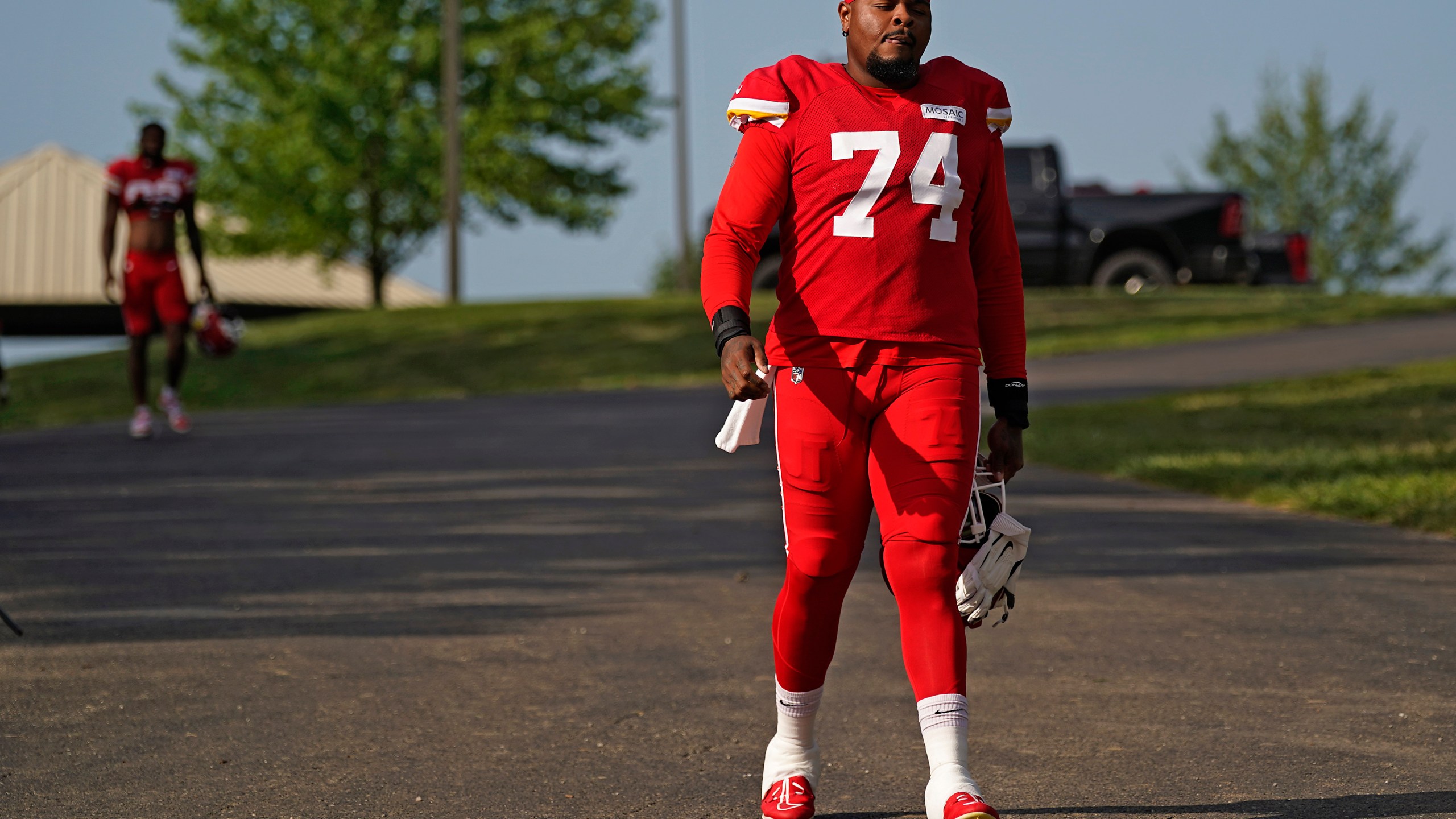 Kansas City Chiefs offensive tackle Jawaan Taylor arrives at NFL football training camp Saturday, July 29, 2023, in St. Joseph, Mo. (AP Photo/Charlie Riedel)