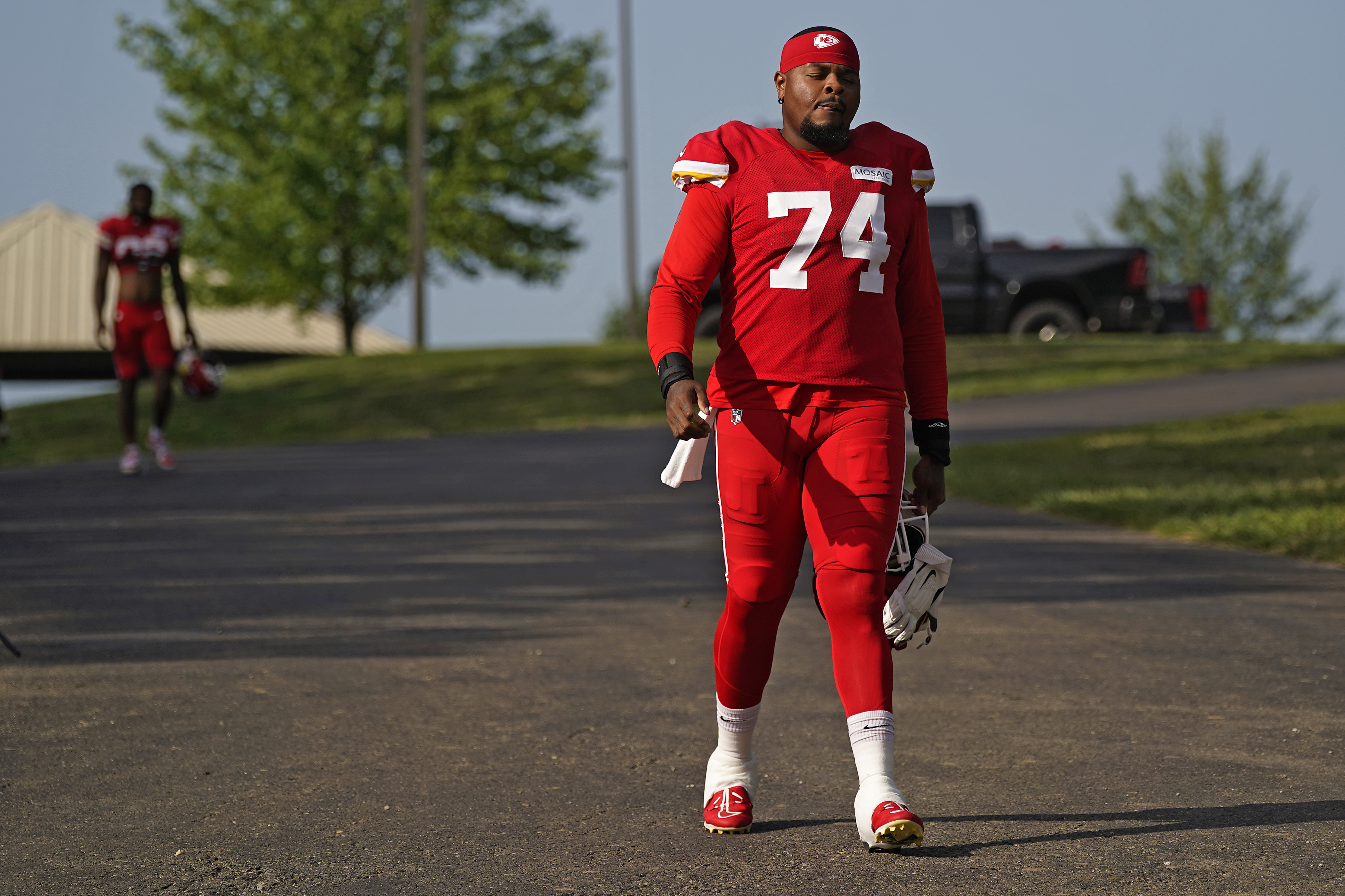 Kansas City Chiefs offensive tackle Jawaan Taylor arrives at NFL football training camp Saturday, July 29, 2023, in St. Joseph, Mo. (AP Photo/Charlie Riedel)