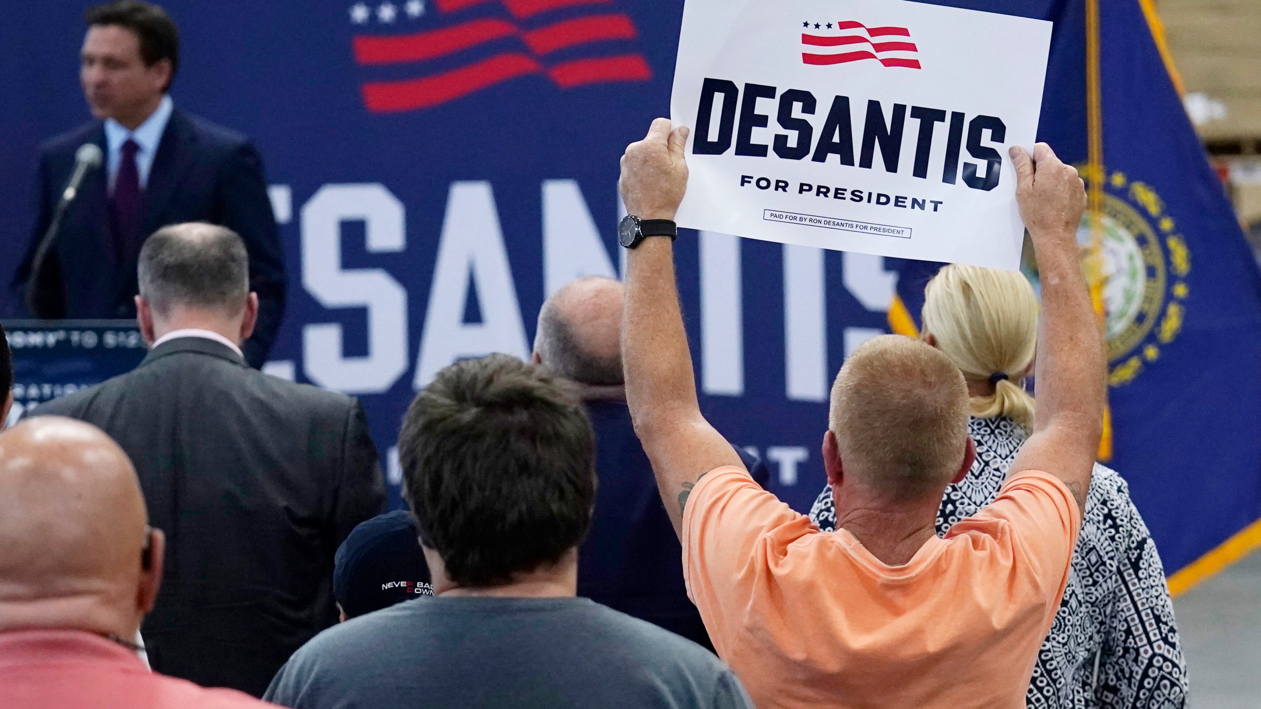 A supporter holds up a sign for Republican presidential candidate Florida Gov. Ron DeSantis during a campaign event, Monday, July 31, 2023, in Rochester, N.H. (AP Photo/Charles Krupa)