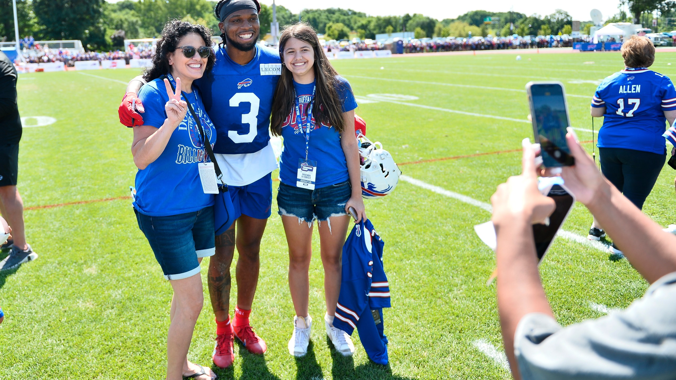 Buffalo Bills safety Damar Hamlin poses for a photo with fans after practice at the NFL football team's training camp in Pittsford, N.Y., Sunday, July 30, 2023. (AP Photo/Adrian Kraus)