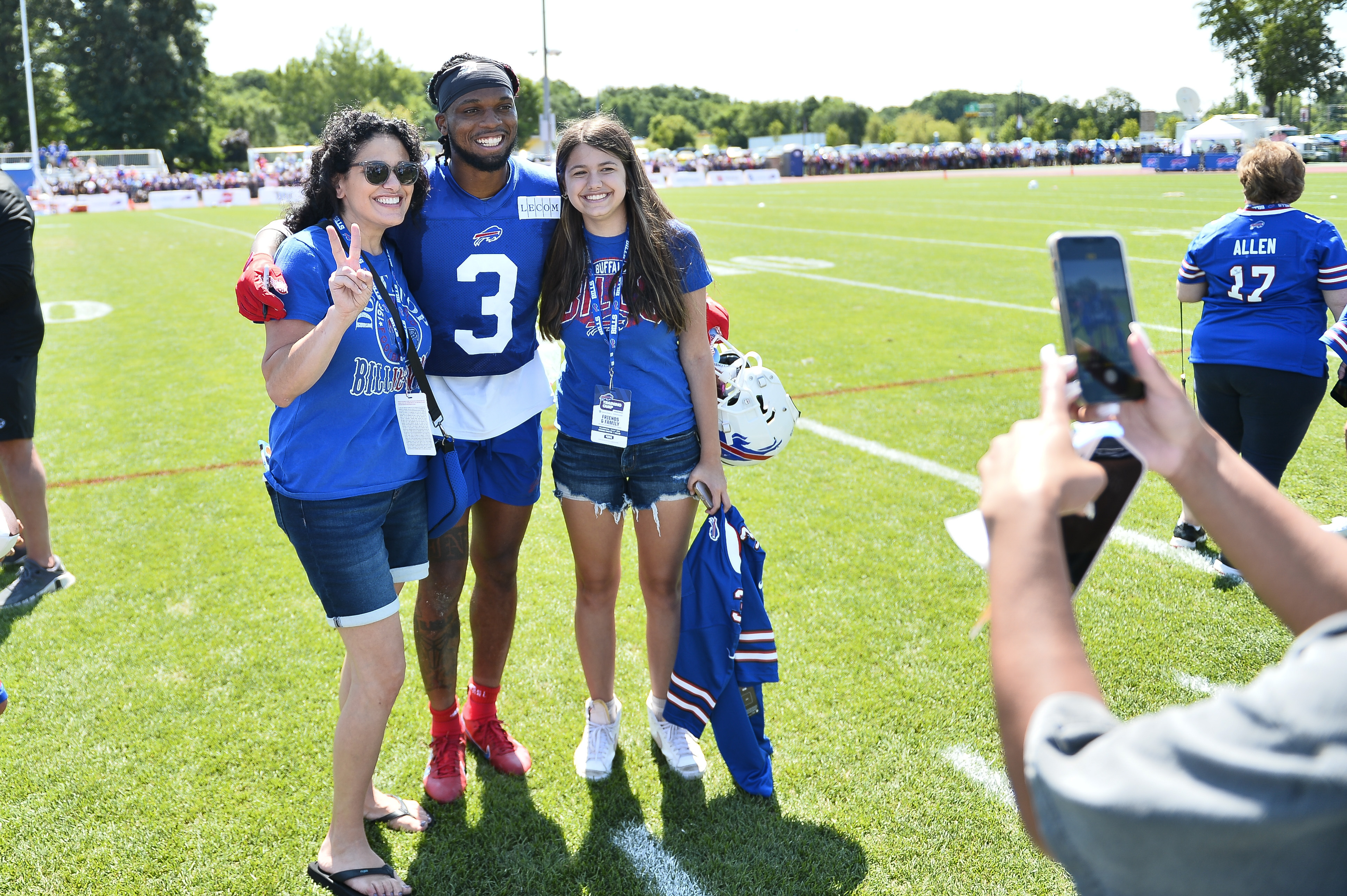 Buffalo Bills safety Damar Hamlin poses for a photo with fans after practice at the NFL football team's training camp in Pittsford, N.Y., Sunday, July 30, 2023. (AP Photo/Adrian Kraus)