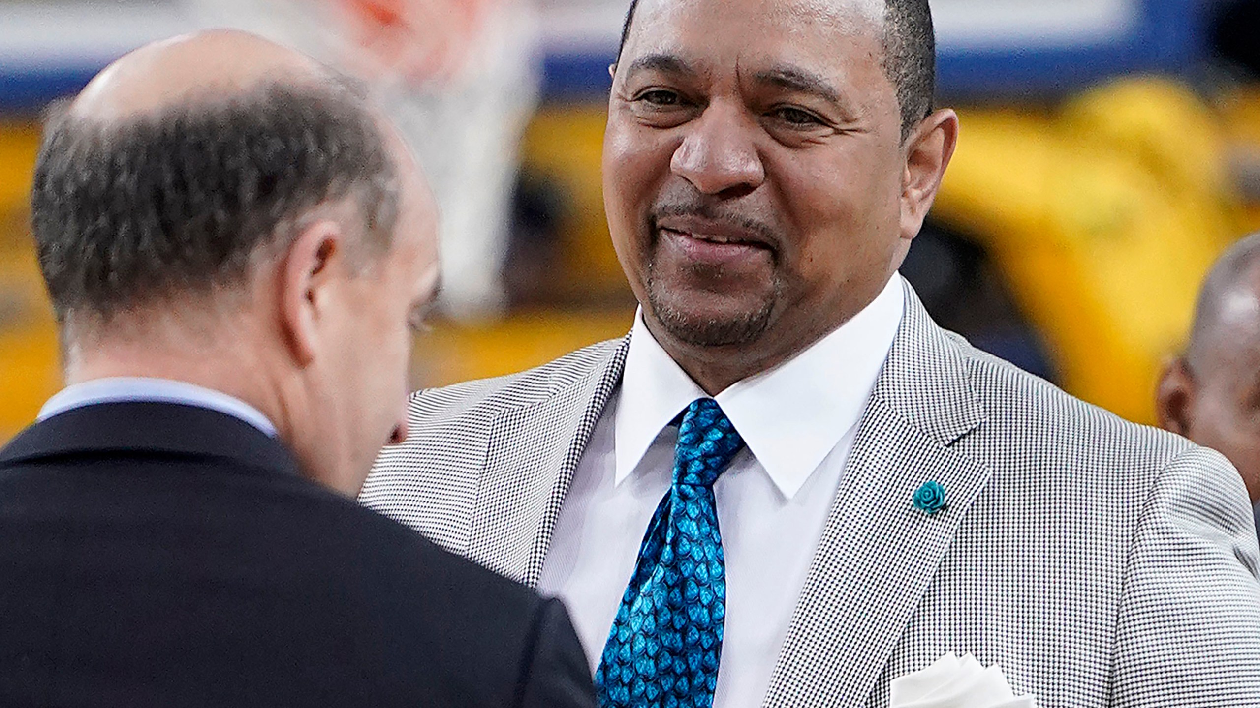 FILE - NBA analyst Mark Jackson, right, talks with Jeff Van Gundy, left, and others before Game 4 of basketball's NBA Finals between the Golden State Warriors and the Toronto Raptors in Oakland, Calif., June 7, 2019. Add Jackson to the long list of ESPN reporters and commentators who have been laid off over the past five weeks. Jackson was let go on Monday, July 31, 2023, with two years remaining on his contract. (AP Photo/Tony Avelar, File)