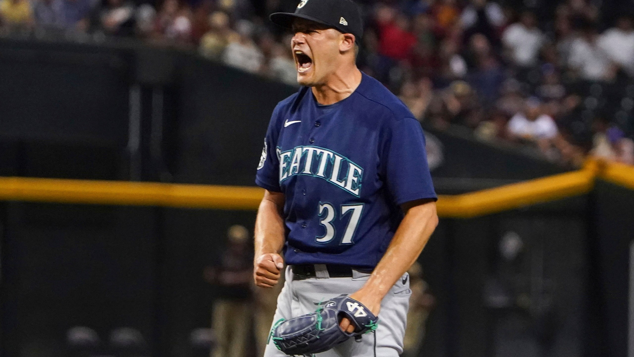 Seattle Mariners pitcher Paul Sewald celebrates striking out Arizona Diamondbacks' Christian Walker for the final out of a baseball game Friday, July 28, 2023, in Phoenix. The Mariners won 5-2. (AP Photo/Darryl Webb)