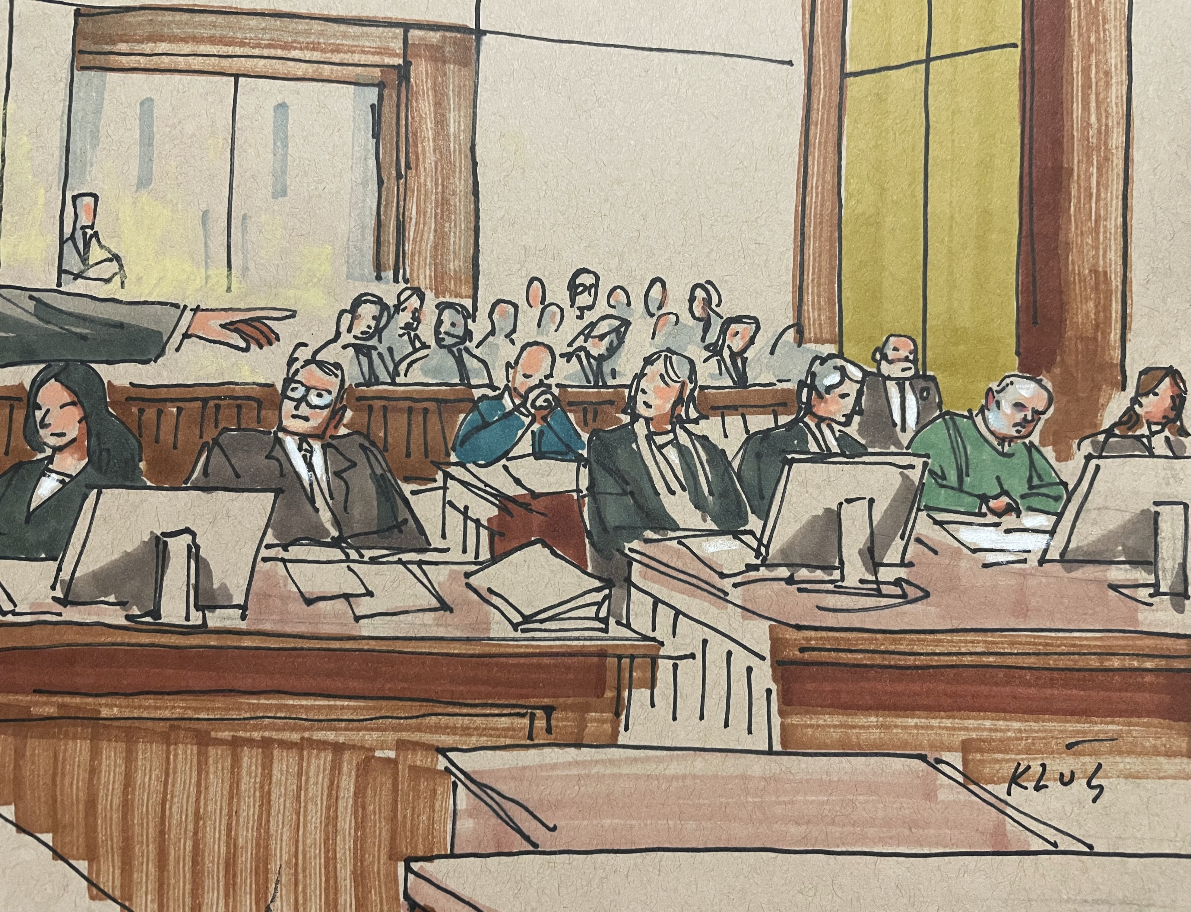 U.S. Attorney Eric Olshan, hand at left, argues before a federal jury that 2018 Pittsburgh synagogue attack defendant Robert Bowers should receive the death penalty, Monday July 31, 2023. Bowers, wearing green, was previously found guilty of killing 11 people in the deadliest antisemitic attack in U.S. history. (Dave Klug via AP)