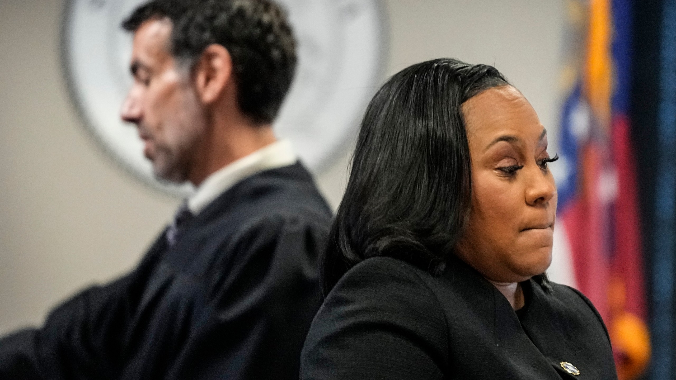 FILE - Fulton County District Attorney Fani Willis, right, and Fulton County Superior Court Judge Robert McBurney speak in the Fulton county courthouse, Tuesday, July 11, 2023, in Atlanta. Lawyers for former President Donald Trump are asking Georgia's highest court to prevent the district attorney who’s been investigating his actions in the wake of the 2020 election from prosecuting him. (AP Photo/Brynn Anderson, File)