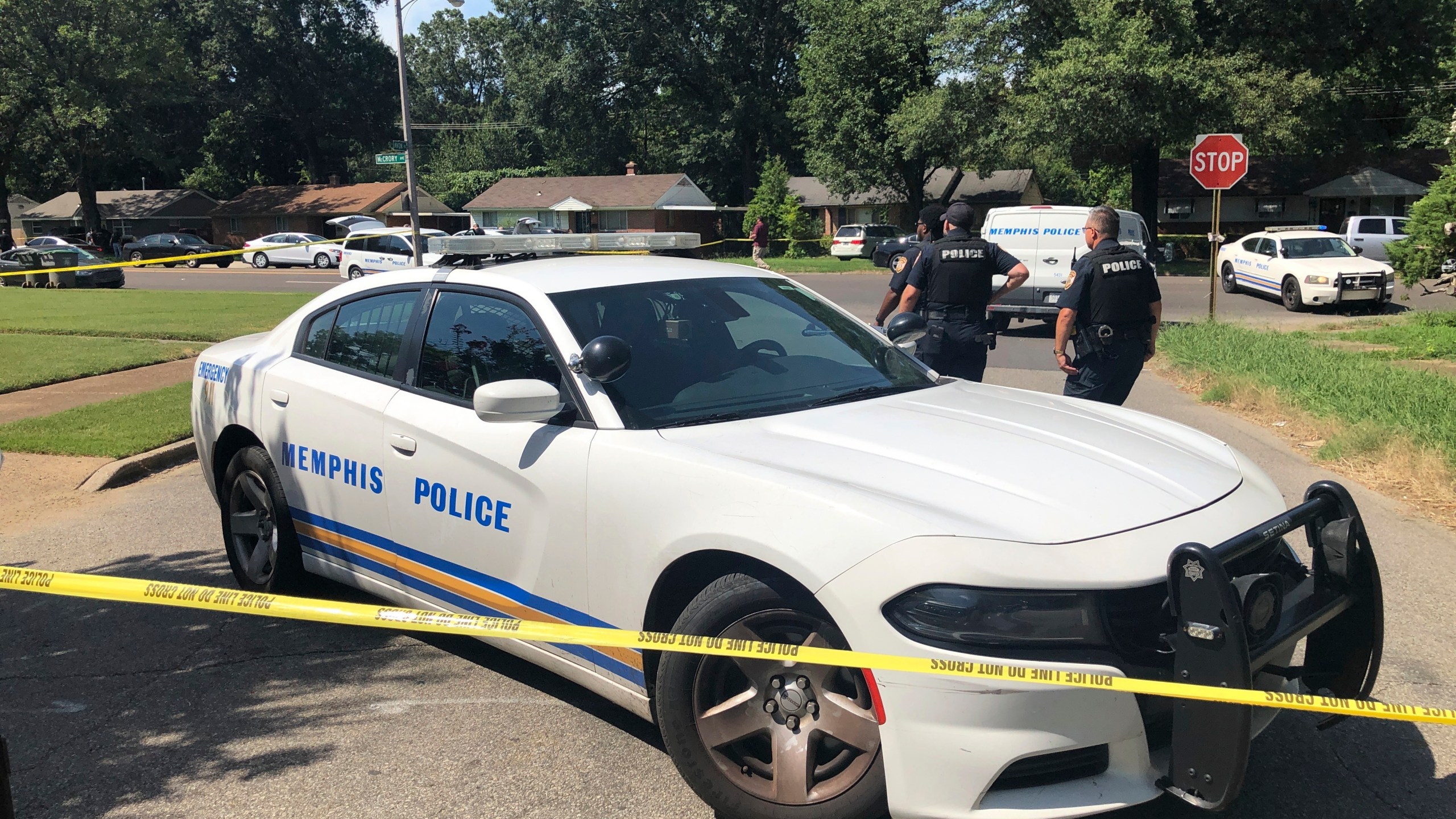 Memphis police officers work the scene of an officer-involved shooting, Monday, July 31, 2023, in Memphis, Tenn. Memphis police said officers shot a suspect after he attempted to enter a Jewish school with a gun and fired shots after he couldn't get into the building. (AP Photo/Adrian Sainz)