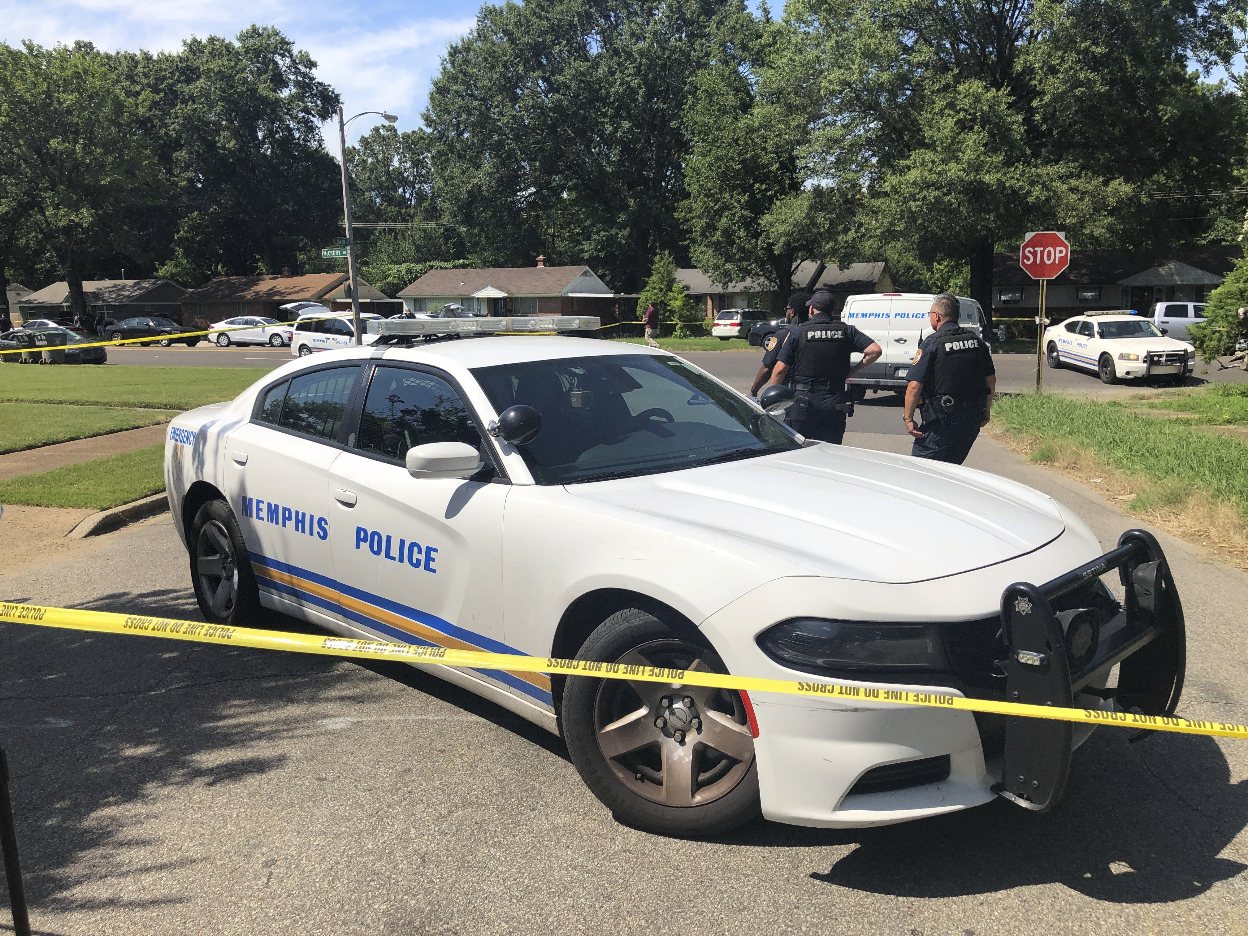 Memphis police officers work the scene of an officer-involved shooting, Monday, July 31, 2023, in Memphis, Tenn. Memphis police said officers shot a suspect after he attempted to enter a Jewish school with a gun and fired shots after he couldn't get into the building. (AP Photo/Adrian Sainz)