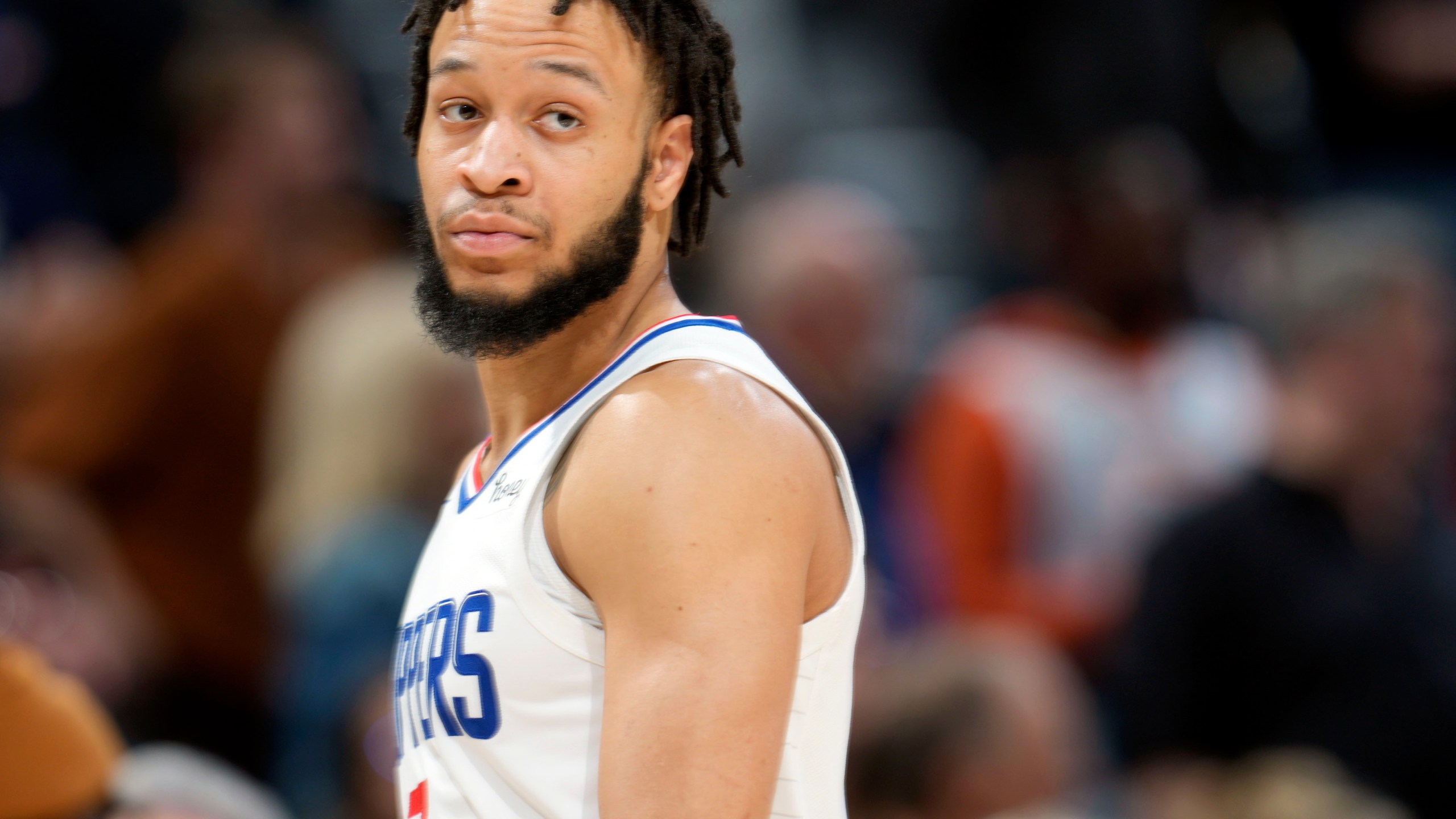 FILE - Los Angeles Clippers guard Amir Coffey looks on during overtime of an NBA basketball game Feb. 26, 2023, in Denver. Coffey was arrested early Sunday, July 30, 2023, on a firearms misdemeanor in Hollywood, authorities said. (AP Photo/David Zalubowski, File)