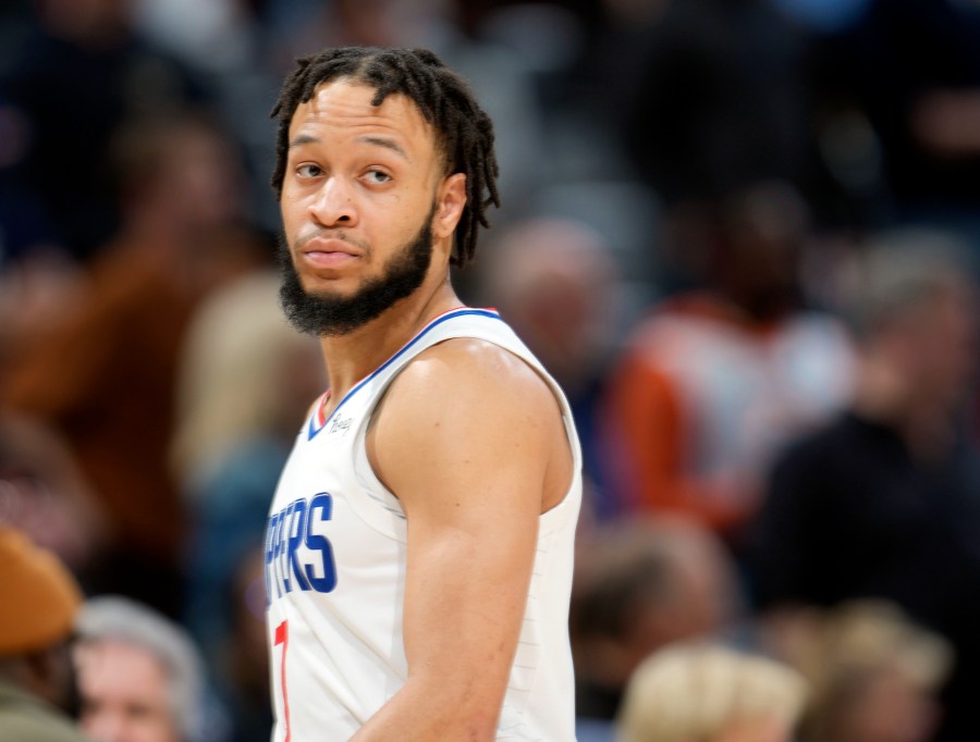 FILE - Los Angeles Clippers guard Amir Coffey looks on during overtime of an NBA basketball game Feb. 26, 2023, in Denver. Coffey was arrested early Sunday, July 30, 2023, on a firearms misdemeanor in Hollywood, authorities said. (AP Photo/David Zalubowski, File)