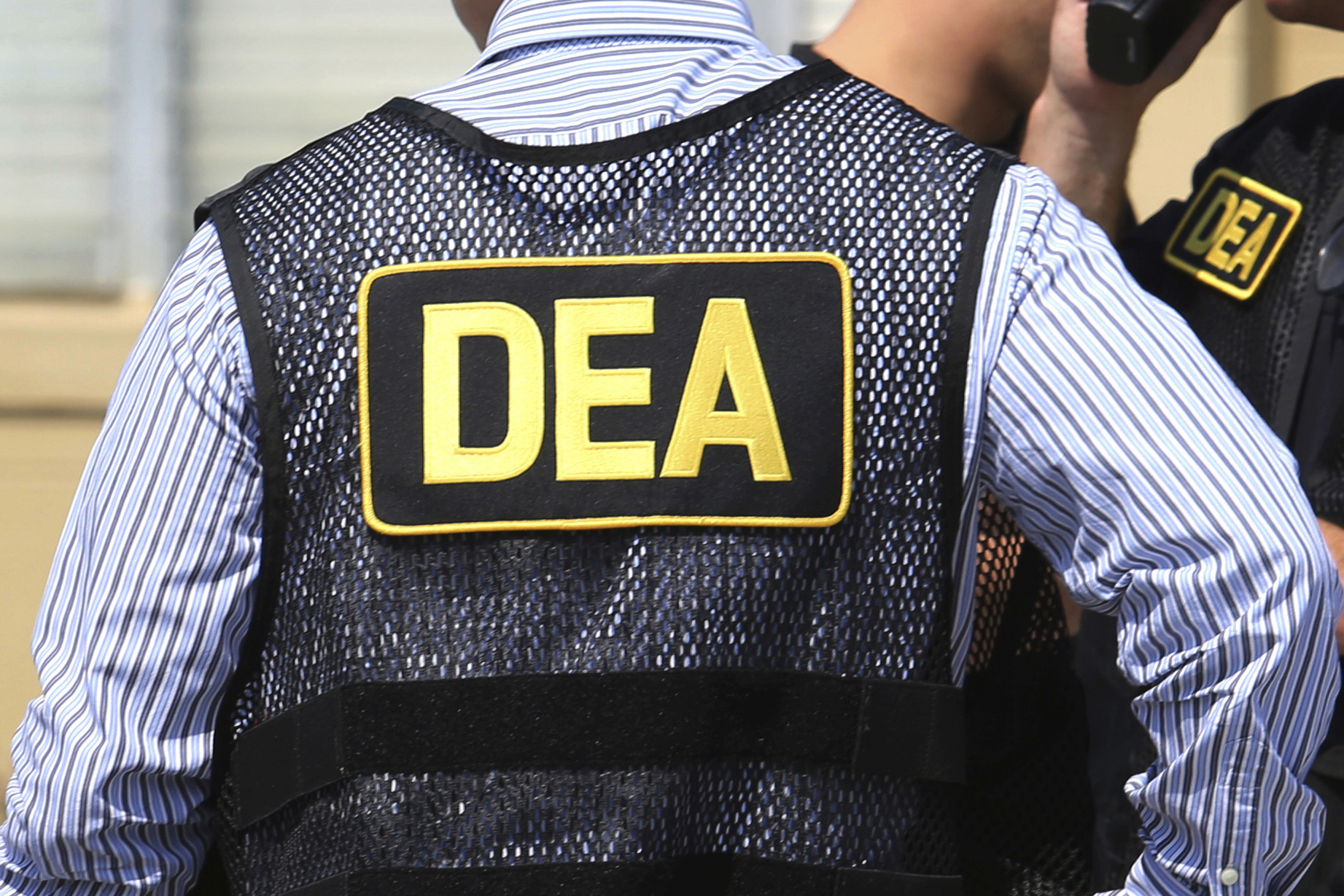 FILE - Drug Enforcement Administration agents are seen in Florida, June 13, 2016. (Joe Burbank/Orlando Sentinel via AP, File)