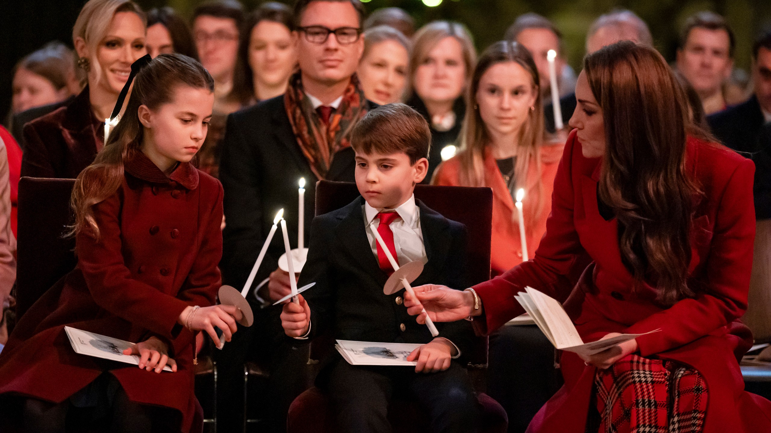 Britain's Princess Charlotte, from left, Prince Louis and Britain's Kate, the Princess of Wales, during the Together At Christmas carol service at Westminster Abbey, in London, Friday, Dec. 6, 2024. (Aaron Chown/Pool Photo via AP)