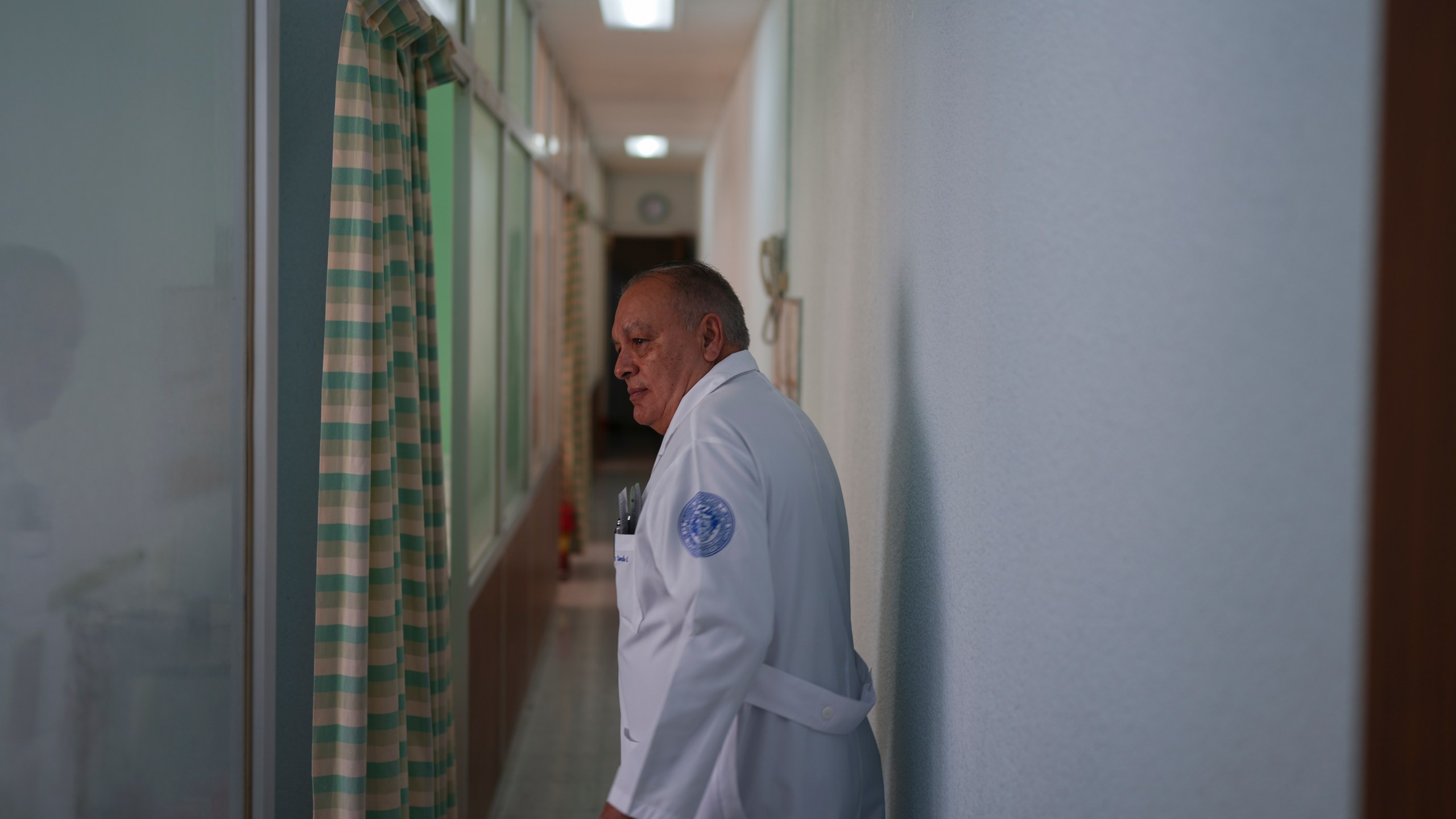 Dr. Octaviano Rosalez, 71, president of the Hospital de Jesus board of trustees, walks through a hospital corridor, in Mexico City, Tuesday, Nov. 12, 2024. (AP Photo/Eduardo Verdugo)