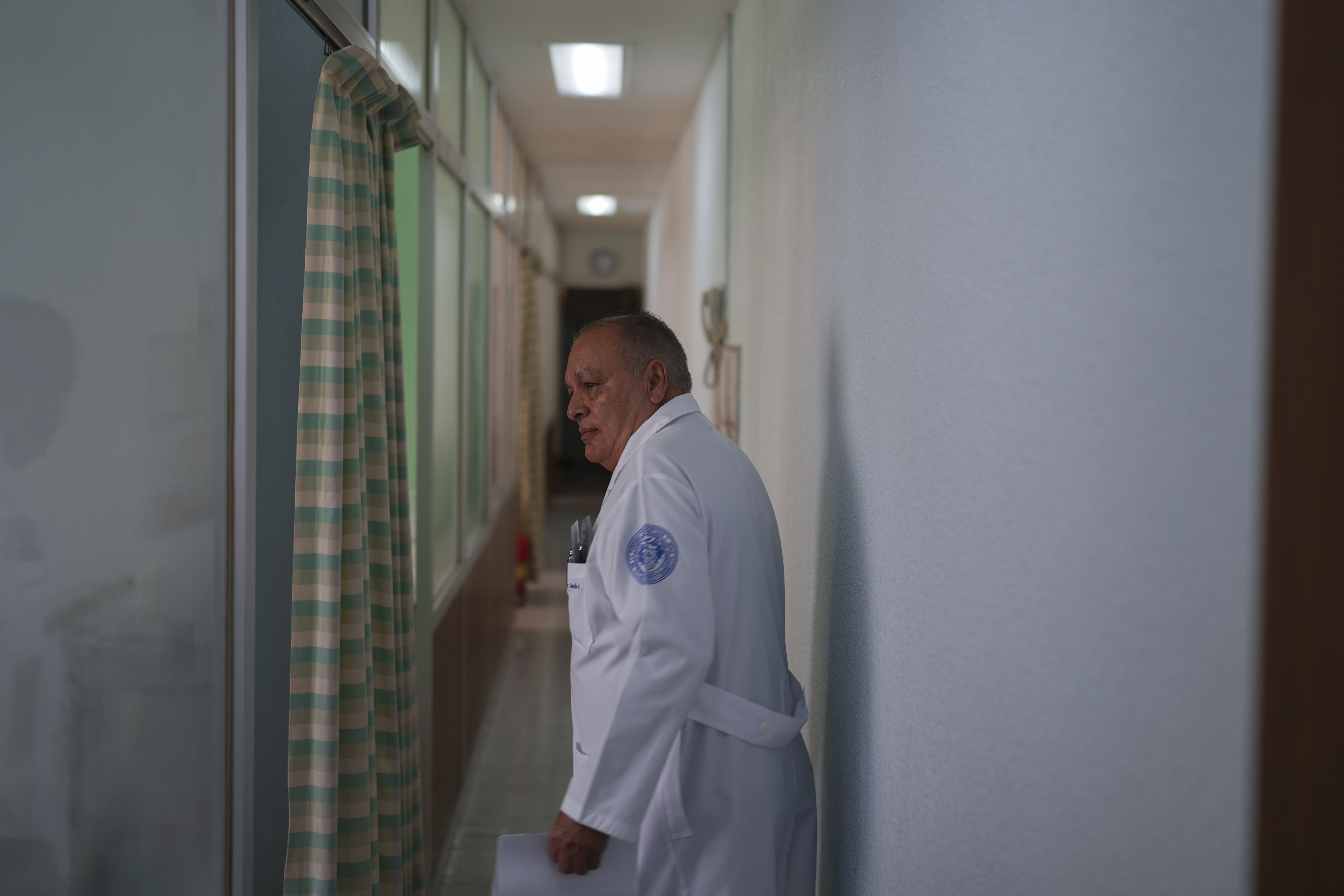 Dr. Octaviano Rosalez, 71, president of the Hospital de Jesus board of trustees, walks through a hospital corridor, in Mexico City, Tuesday, Nov. 12, 2024. (AP Photo/Eduardo Verdugo)