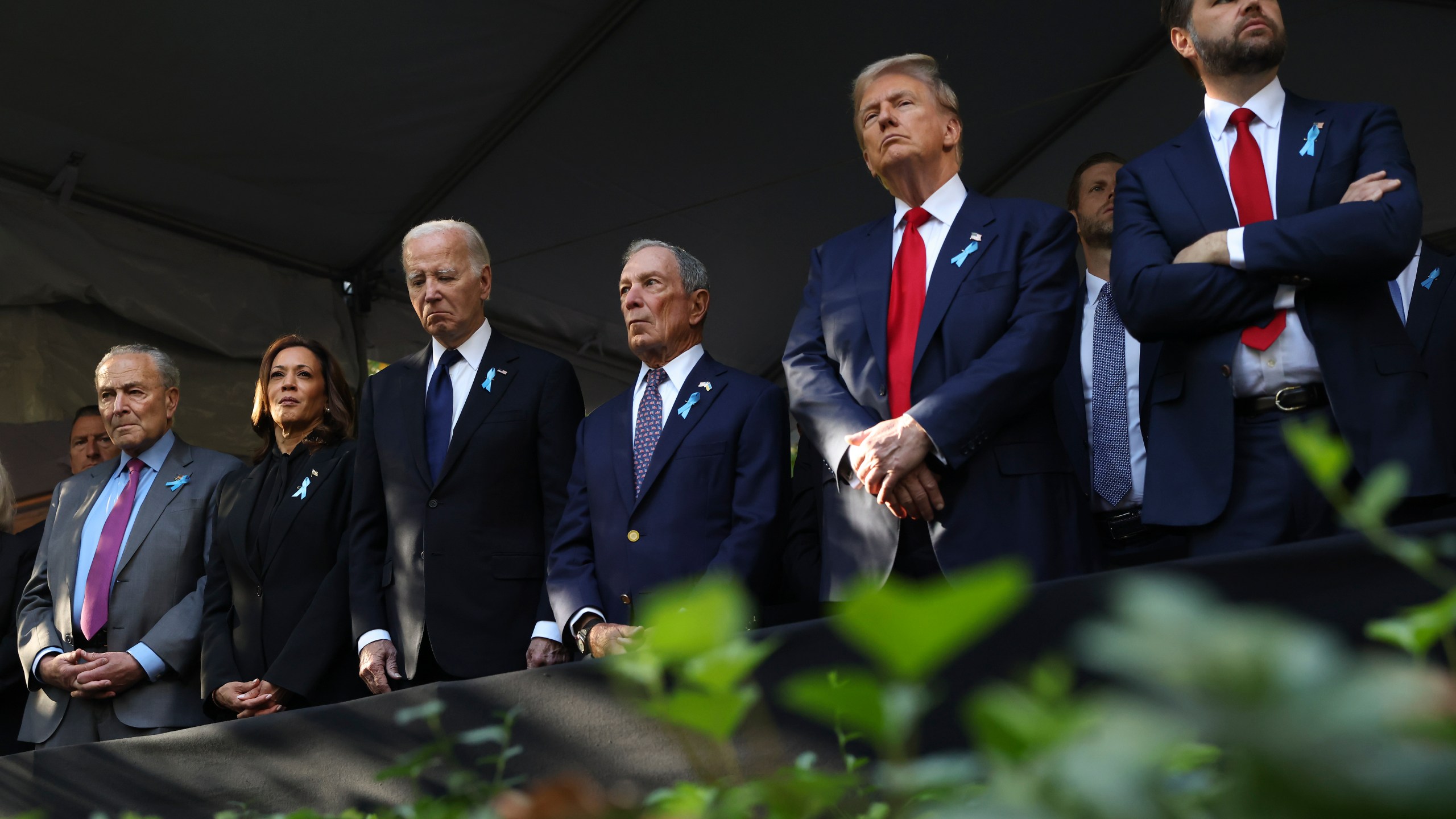 FILE - From left, Sen. Chuck Schumer, D-NY, Democratic presidential nominee Vice President Kamala Harris, President Joe Biden, Michael Bloomberg, Republican presidential nominee former President Donald Trump and Republican vice presidential nominee Sen. JD Vance, R-Ohio, attend the 9/11 Memorial ceremony on the 23rd anniversary of the Sept. 11, 2001 attacks, on Sept. 11, 2024, in New York. (AP Photo/Yuki Iwamura, File)