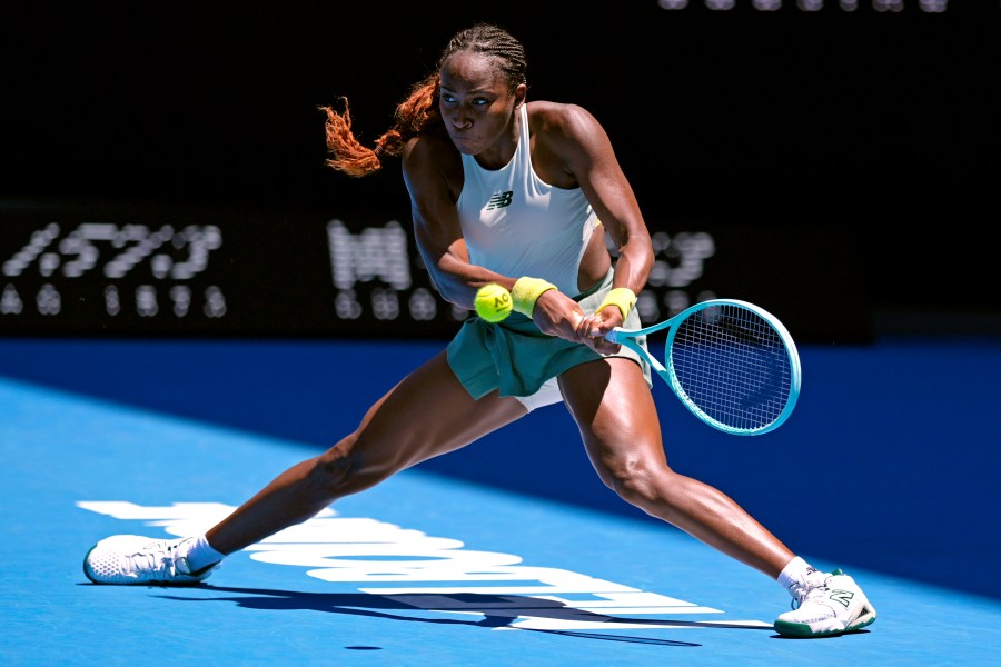 Coco Gauff of the U.S. plays a backhand return to Sofia Kenin of the U.S. during their first round match at the Australian Open tennis championship in Melbourne, Australia, Monday, Jan. 13, 2025. (AP Photo/Asanka Brendon Ratnayake)