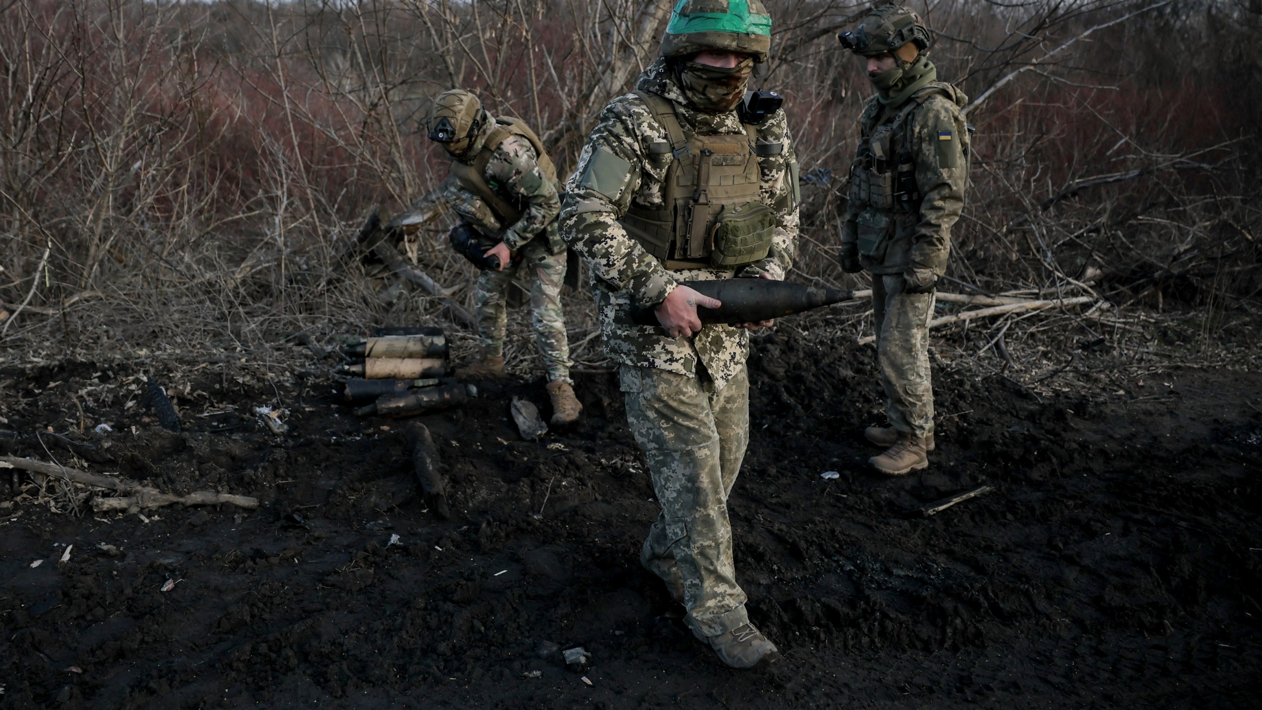 Ukrainian servicemen collect damaged ammunition on the road at the front line near Chasiv Yar town, in Donetsk region, Ukraine, Ukraine, Friday, Jan. 10, 2025. (Oleg Petrasiuk/Ukraine's 24th Mechanised Brigade via AP)