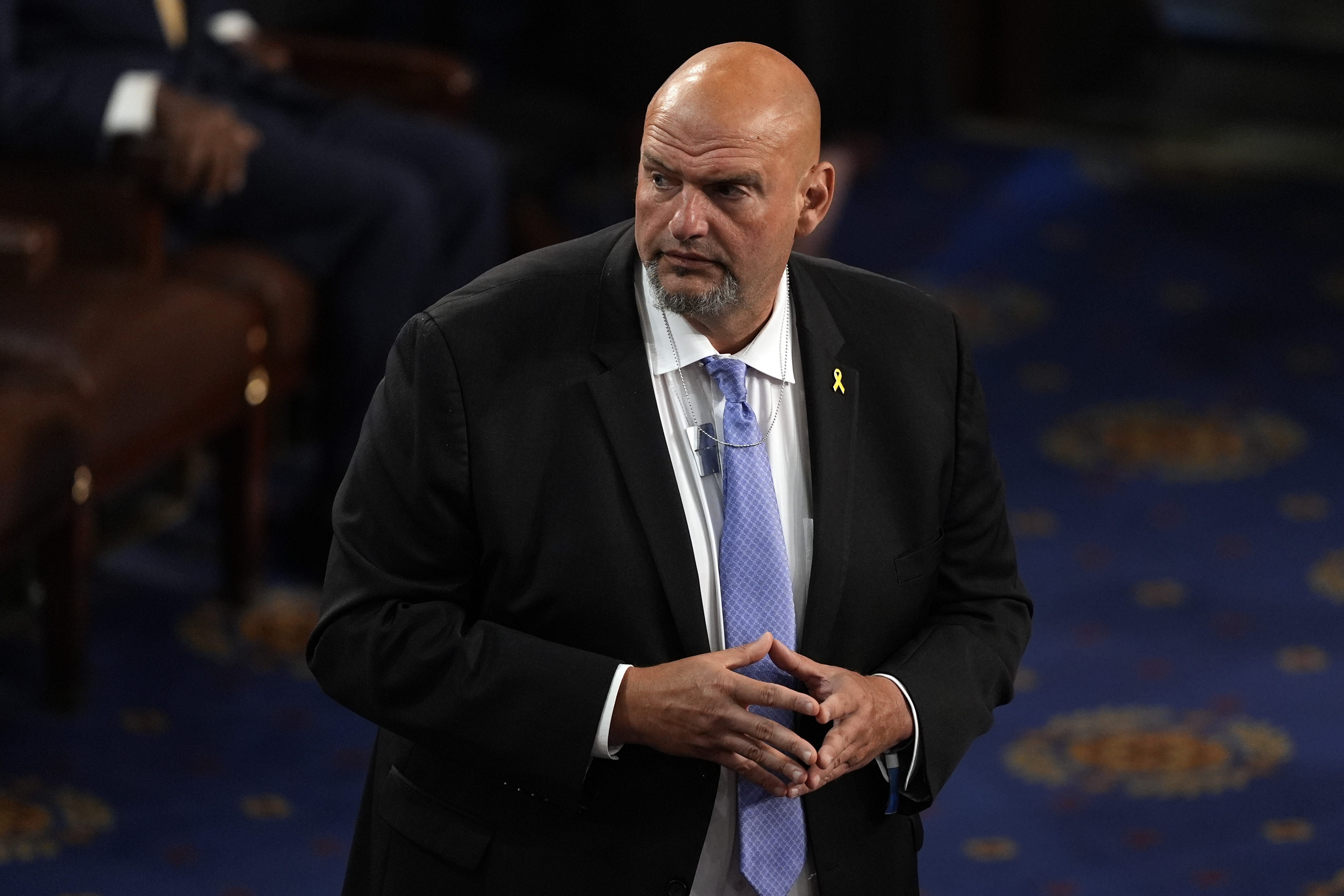 FILE - Sen. John Fetterman, D-Pa., wears a pendant in support of freeing hostages being held by Hamas home, before Israeli Prime Minister Benjamin Netanyahu speaks to a joint meeting of Congress at the Capitol in Washington, July 24, 2024. (AP Photo/Julia Nikhinson, File)