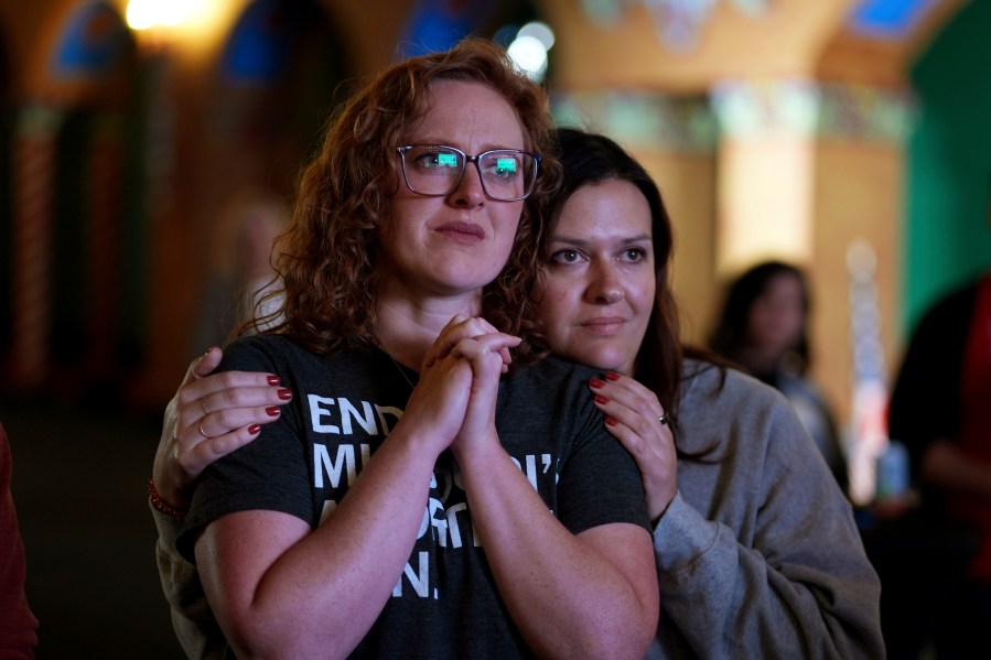 FILE - People giving their first names Erika, left, and Leeann react after an abortion rights amendment to the Missouri constitution passed, Tuesday, Nov. 5, 2024, at a watch party in Kansas City, Mo. (AP Photo/Charlie Riedel, File)