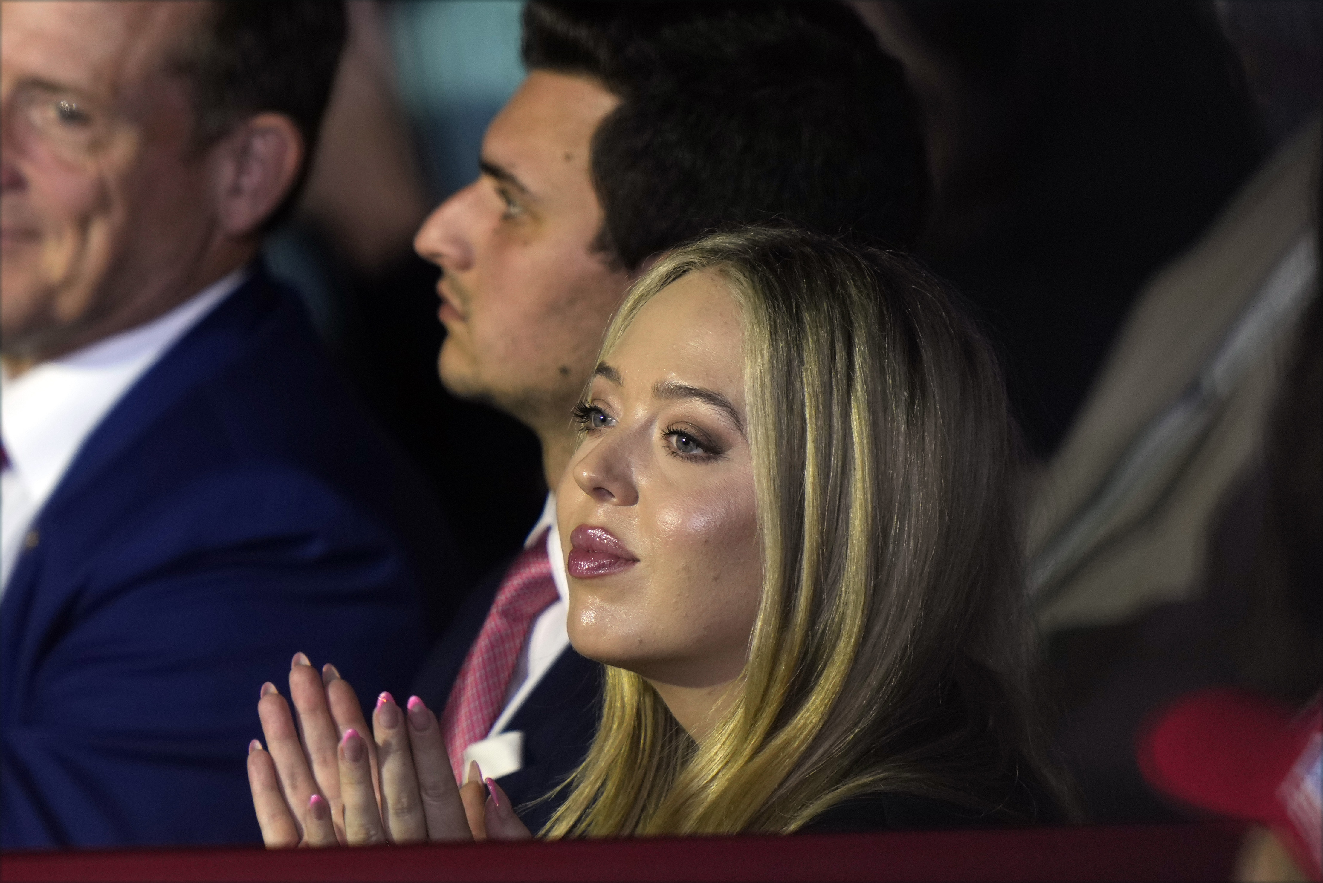 FILE - Tiffany Trump and her husband, Michael Boulos, listen as Republican presidential nominee former President Donald Trump speaks at a campaign rally at Williams Arena at Mignes Coliseum, Oct. 21, 2024, in Greenville, N.C. (AP Photo/Julia Demaree Nikhinson, File)