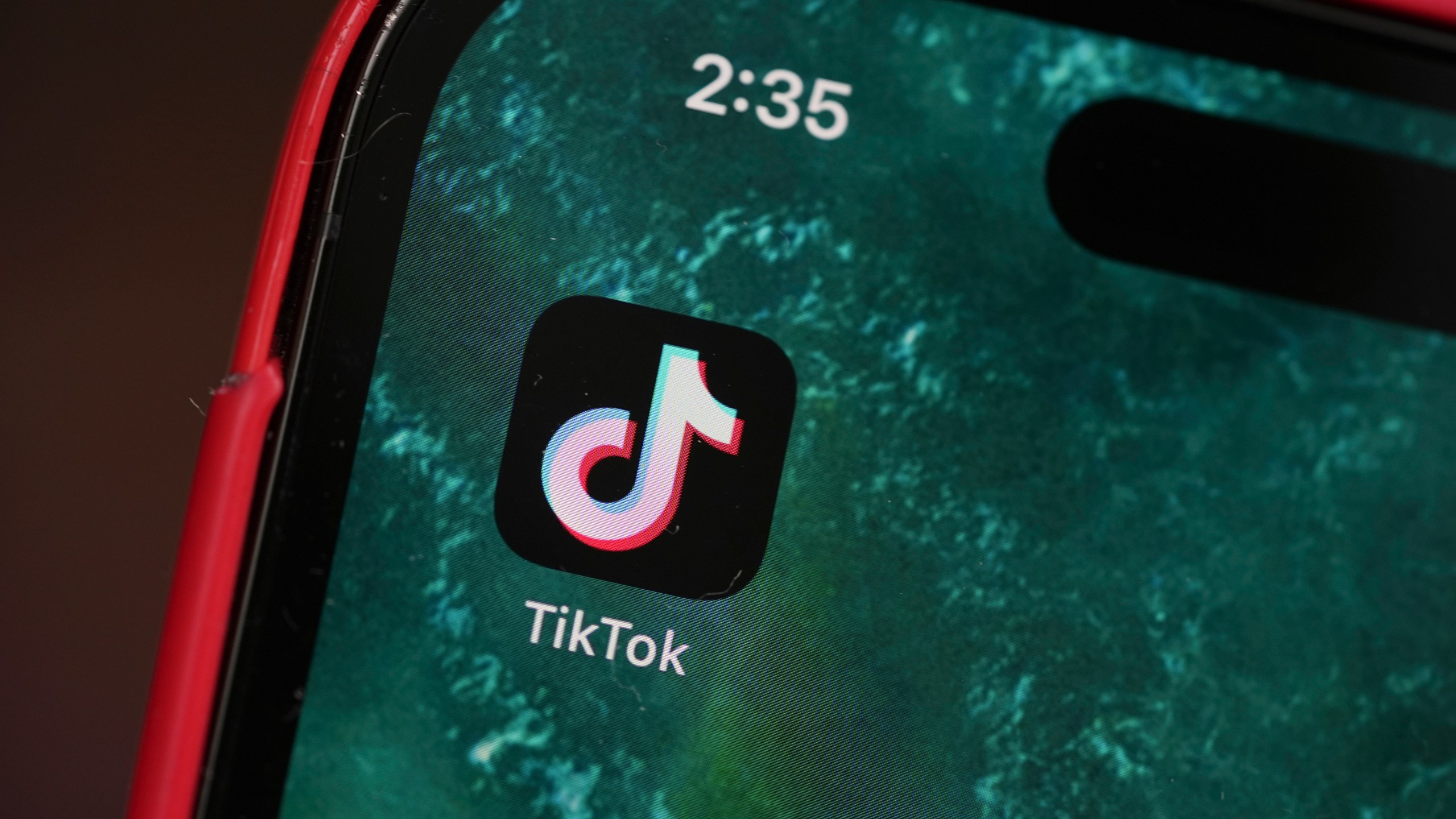 The logo for TikTok is displayed on a mobile phone, Friday, Jan. 17, 2025, in Denver. (AP Photo/David Zalubowski)