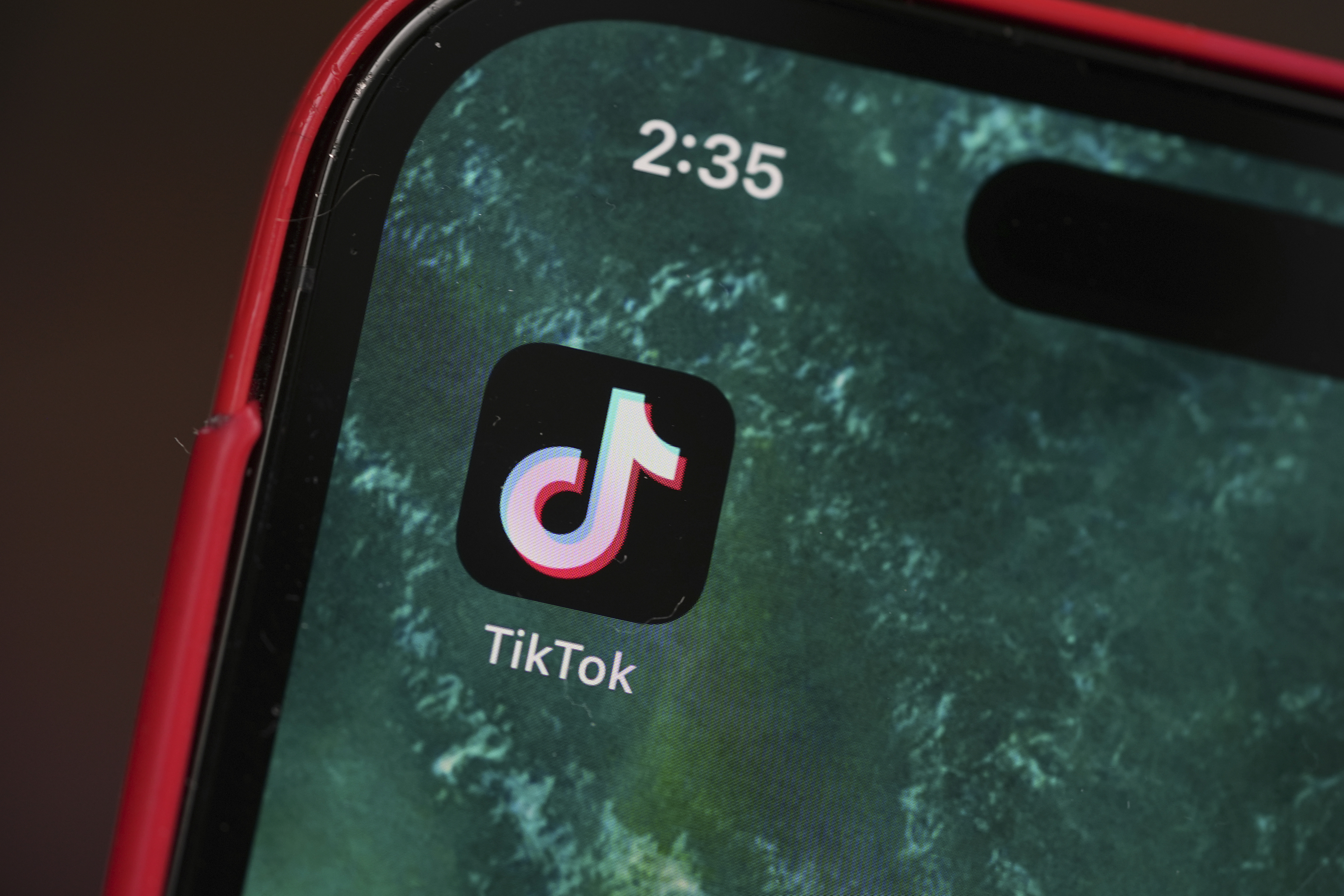 The logo for TikTok is displayed on a mobile phone, Friday, Jan. 17, 2025, in Denver. (AP Photo/David Zalubowski)