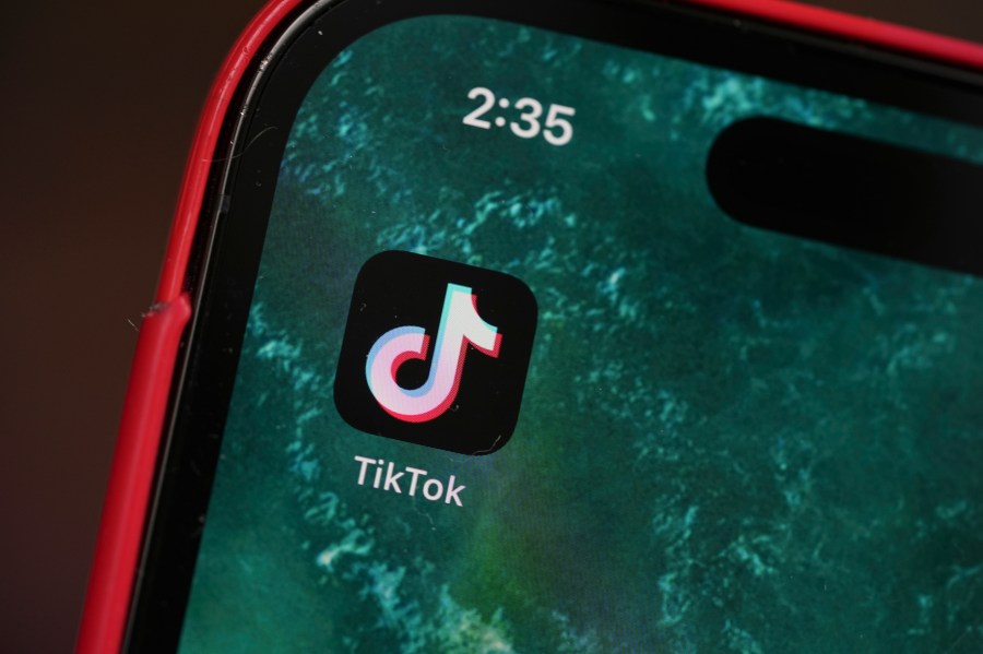 The logo for TikTok is displayed on a mobile phone, Friday, Jan. 17, 2025, in Denver. (AP Photo/David Zalubowski)