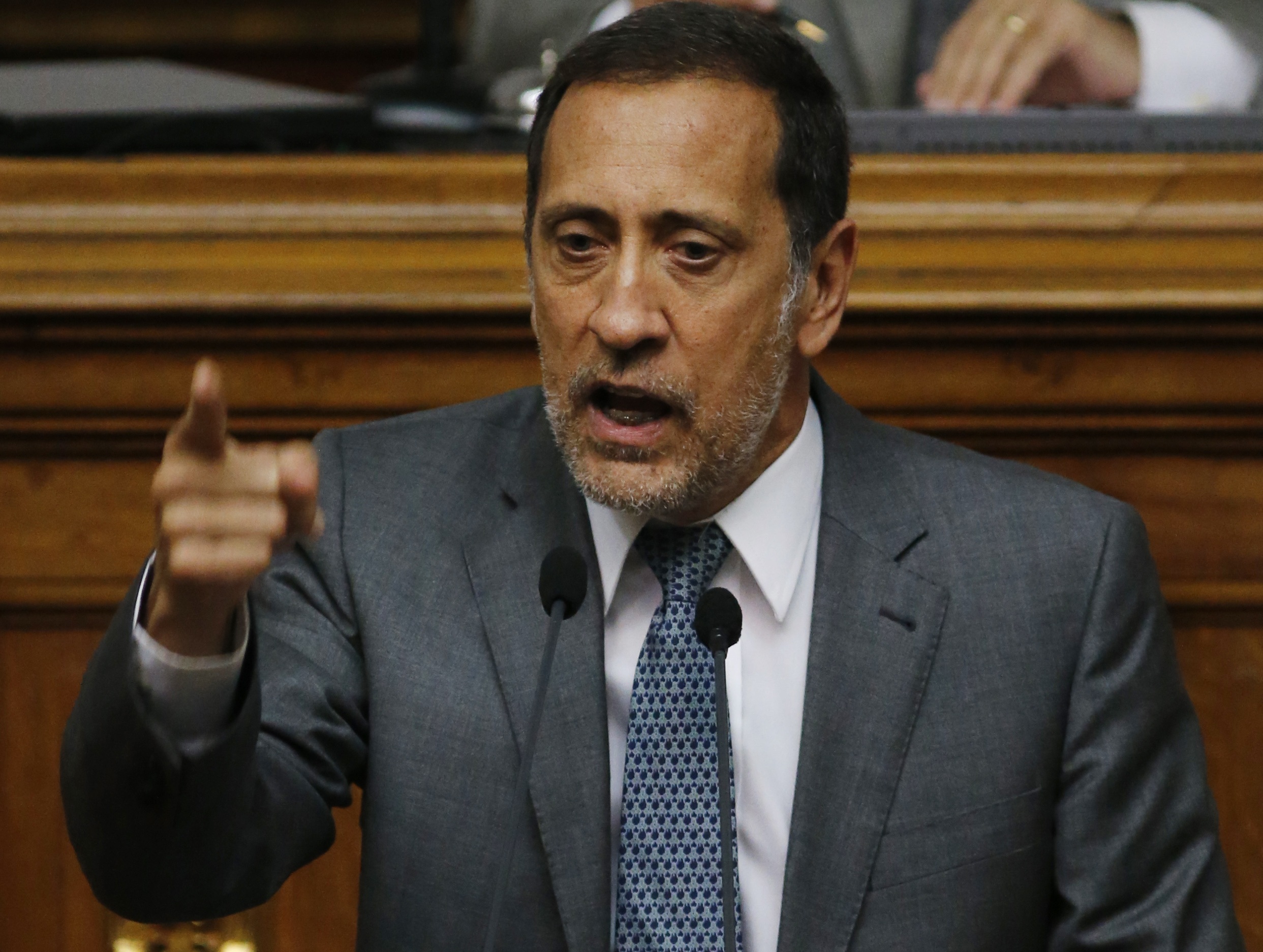 FILE - Opposition lawmaker and economist Jose Guerra speaks during a congressional session in Caracas, Venezuela, Jan. 22, 2016. (AP Photo/Ariana Cubillos, File)