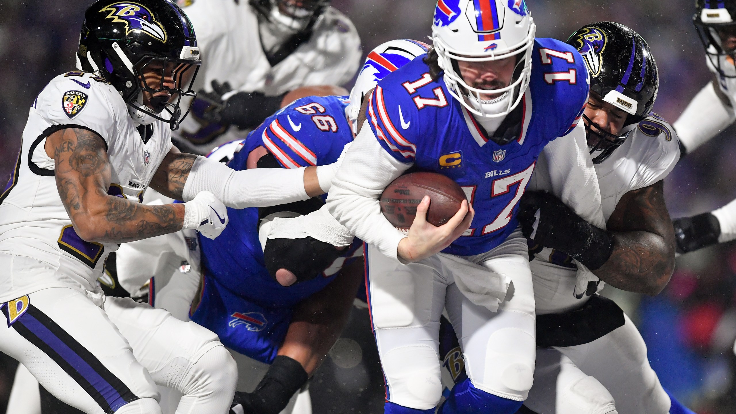 Buffalo Bills quarterback Josh Allen (17) carries the ball into the end zone to score a touchdown against the Baltimore Ravens during the second quarter of an NFL divisional playoff football game, Sunday, Jan. 19, 2025, in Orchard Park, N.Y. (AP Photo/Adrian Kraus)