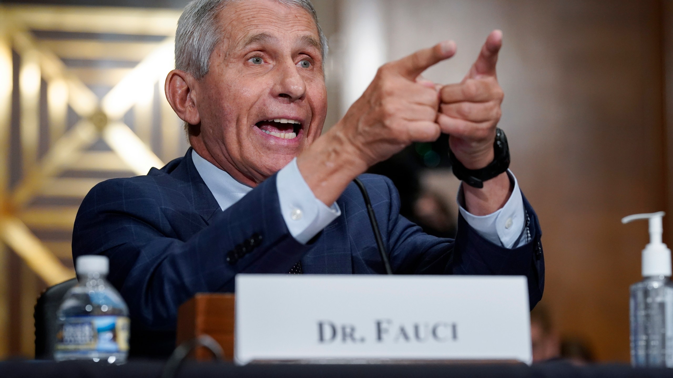 FILE - Dr. Anthony Fauci, director of the National Institute of Allergy and Infectious Diseases, responds to accusations by Sen. Rand Paul, R-Ky., as he testifies before the Senate Health, Education, Labor, and Pensions Committee about the origin of COVID-19, on Capitol Hill in Washington, July 20, 2021. (AP Photo/J. Scott Applewhite, Pool, File)