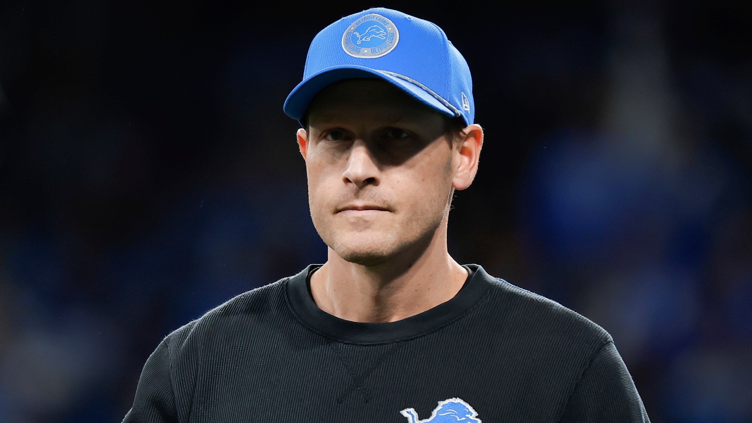 Detroit Lions offensive coordinator Ben Johnson watches during warmups before an NFL football divisional playoff game against the Washington Commanders, Saturday, Jan. 18, 2025, in Detroit. (AP Photo/Rey Del Rio)