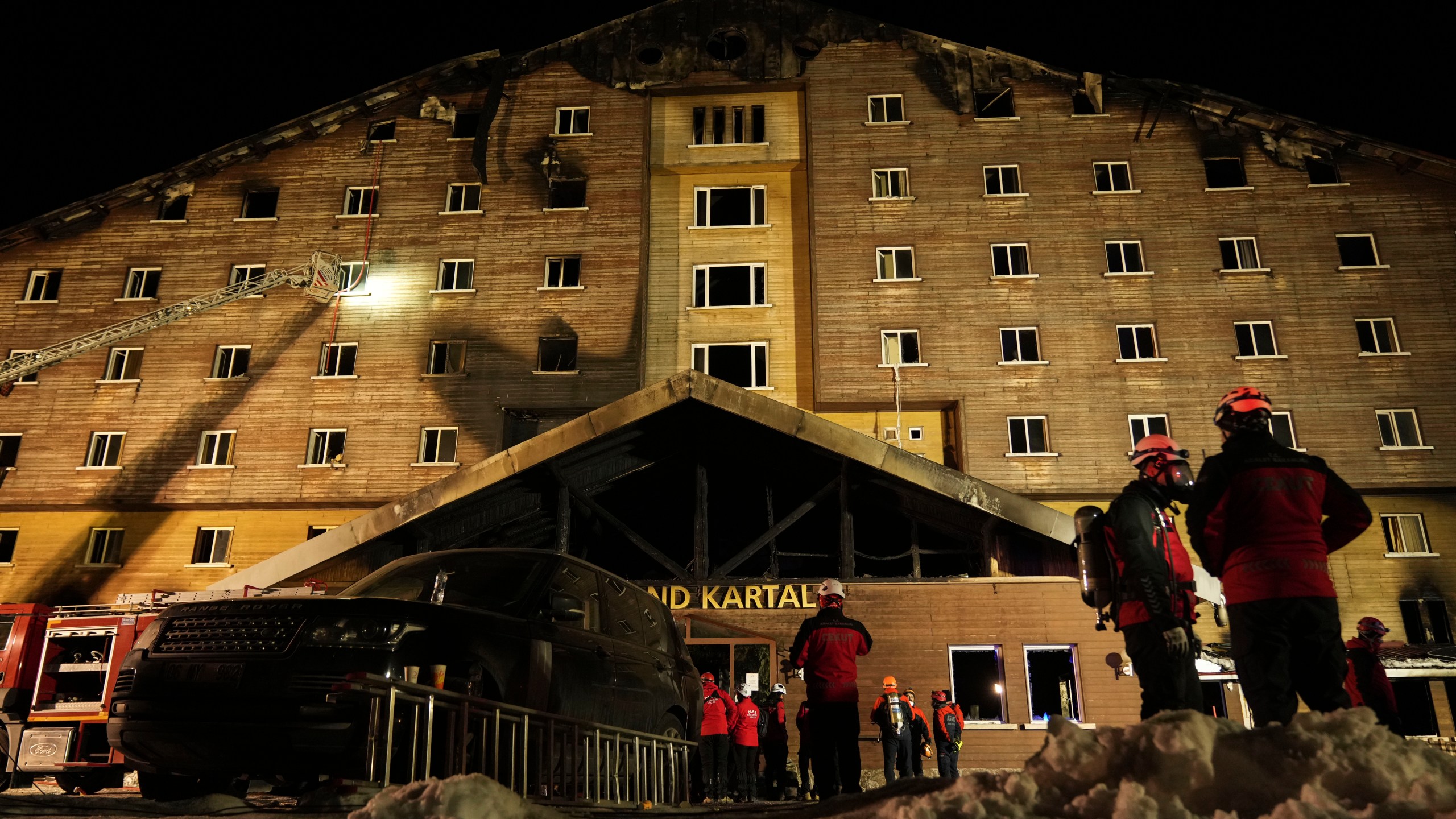 Firefighters and emergency teams work after a fire that broke out at a hotel in the ski resort of Kartalkaya, located in Bolu province, northwest Turkey, on Tuesday, Jan. 21, 2025. (AP Photo/Francisco Seco)