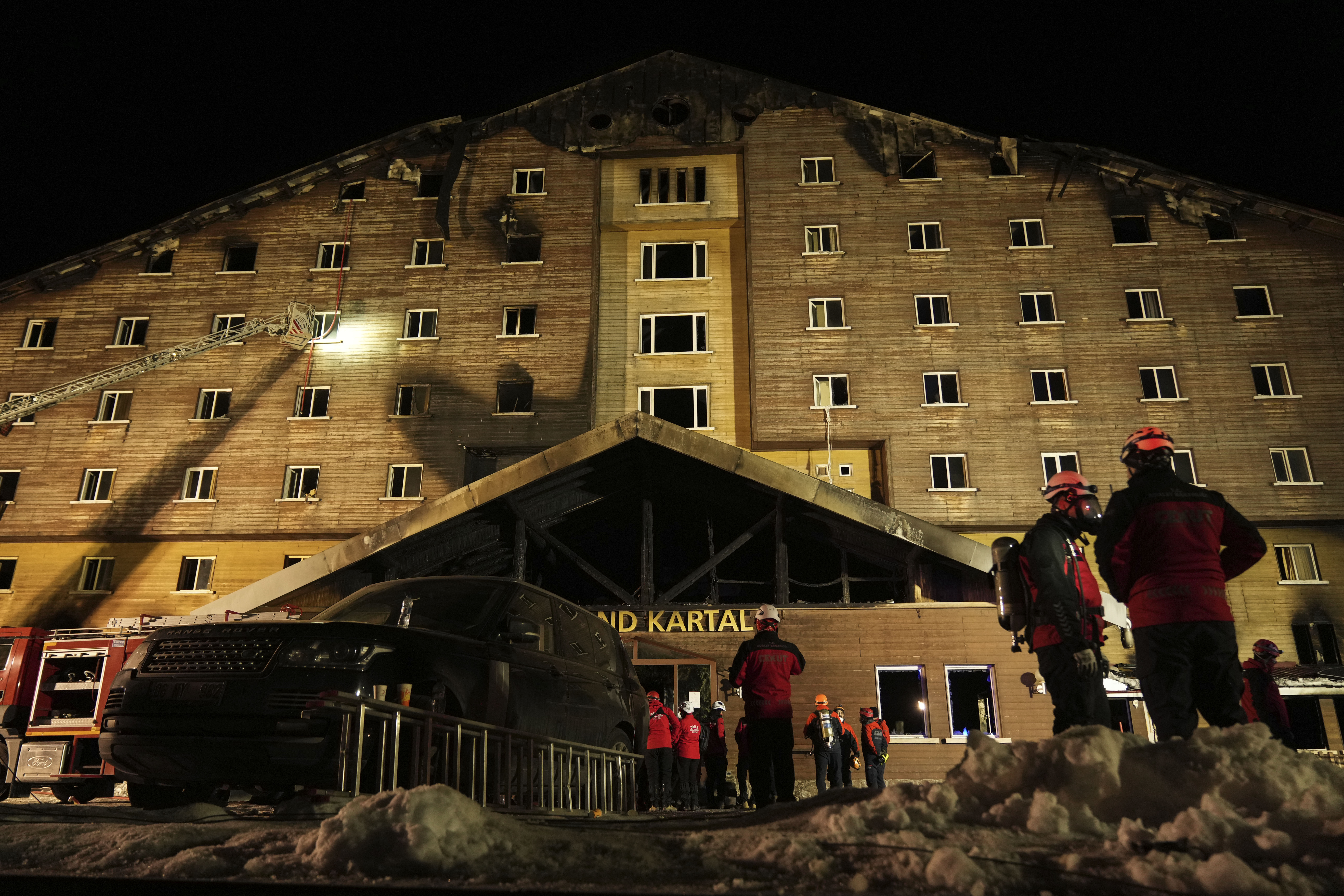 Firefighters and emergency teams work after a fire that broke out at a hotel in the ski resort of Kartalkaya, located in Bolu province, northwest Turkey, on Tuesday, Jan. 21, 2025. (AP Photo/Francisco Seco)