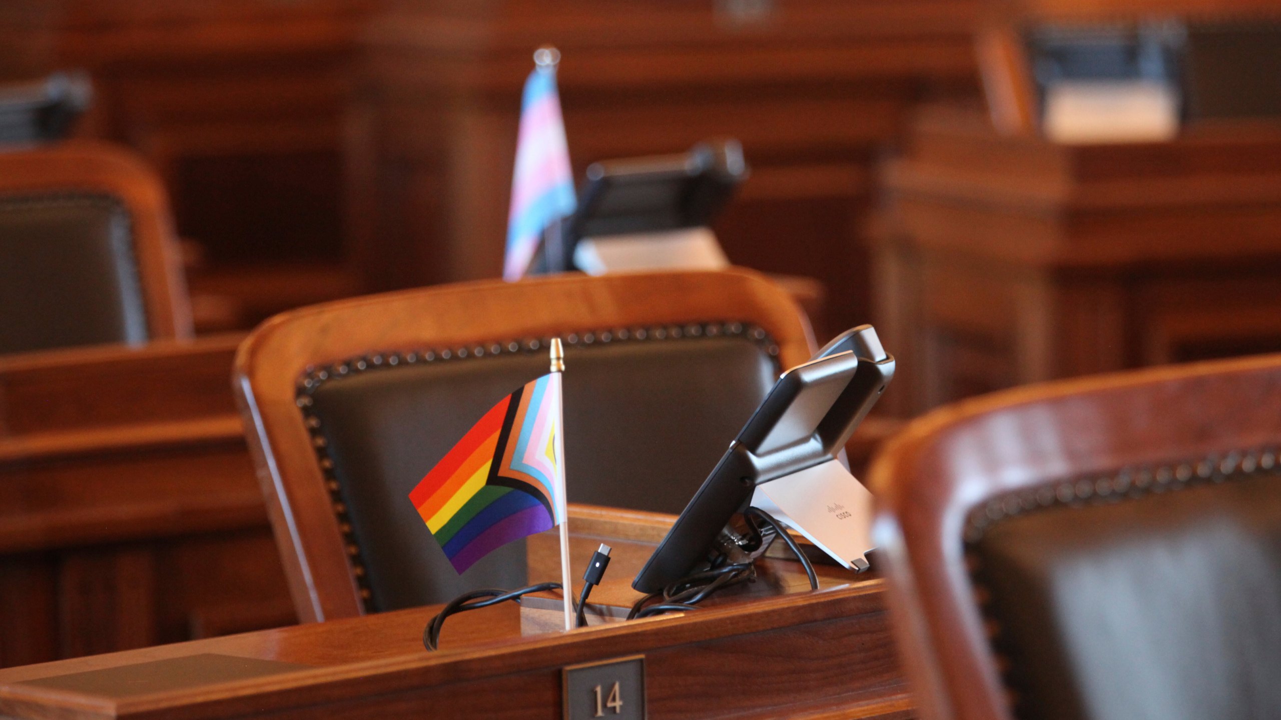 A small flag promoting LGBTQ+ rights sits on the desk of state Rep. Jo Ella Hoye, D-Lenexa, in the House chamber as Republicans prepare to push for a ban on gender-affirming care for transgender minors, Thursday, Jan. 16, 2025, in the Statehouse in Topeka, Kan. (AP Photo/John Hanna)