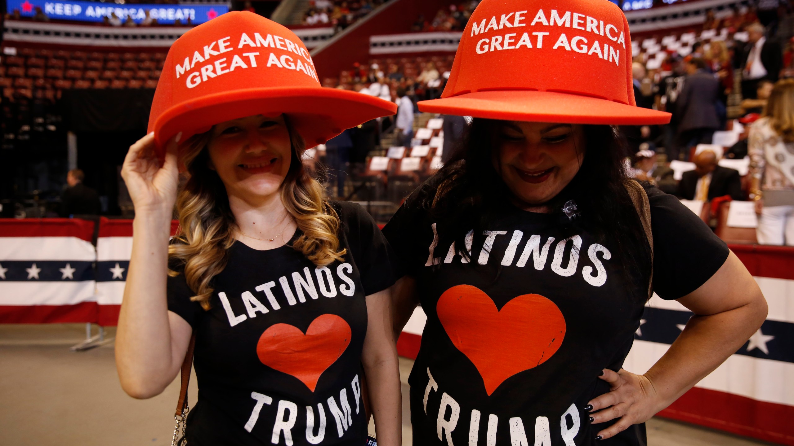 FILE - Supports wear large "Make America Great Again" hats before President Donald Trump's rally on Tuesday, Nov. 26, 2019, in Sunrise, Fla. (AP Photo/Brynn Anderson, File)