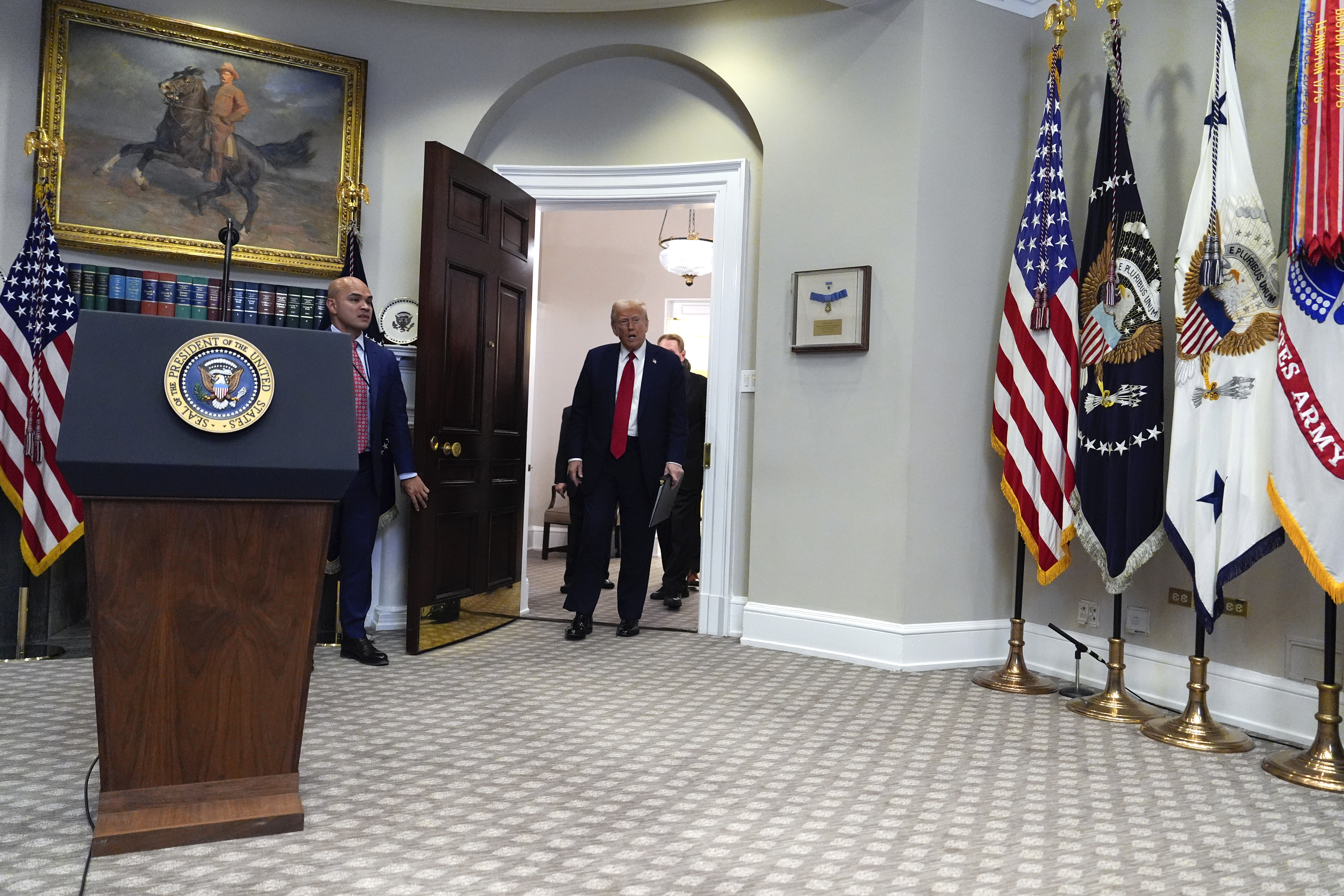 President Donald Trump arrives to speak in the Roosevelt Room at the White House, Tuesday, Jan. 21, 2025, in Washington. (AP Photo/Julia Demaree Nikhinson)