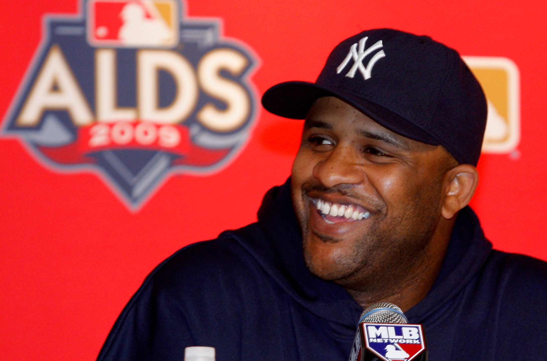 FILE - New York Yankees pitcher CC Sabathia smiles as he discusses the team's upcoming American League division series during a baseball press conference at Yankee Stadium Tuesday, Oct. 6, 2009 in New York. (AP Photo/Kathy Willens, File)