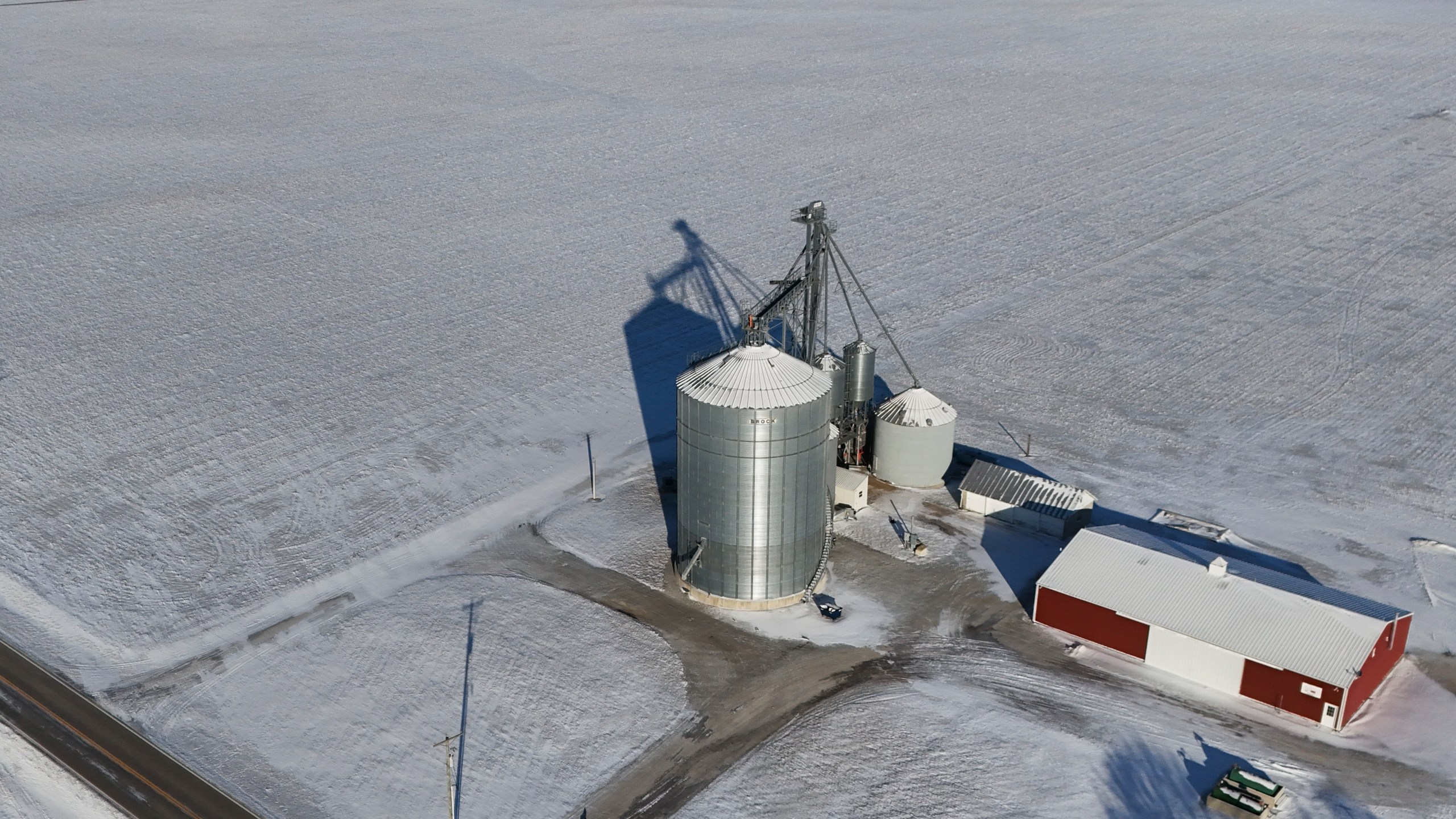 Snow blankets fields at Zoe Kent's farm, Monday, Jan. 20, 2025, in Bucyrus, Ohio. (AP Photo/Joshua A. Bickel)