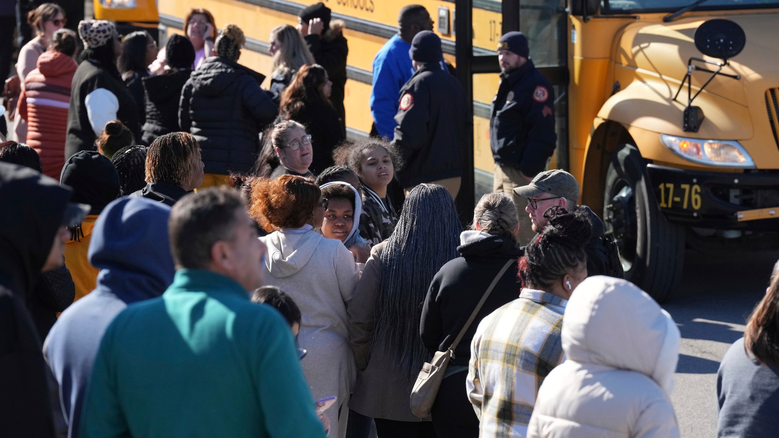 School buses arrive at a unification site following a shooting at the Antioch High School in Nashville, Tenn., Wednesday, Jan. 22, 2025. (AP Photo/George Walker IV)