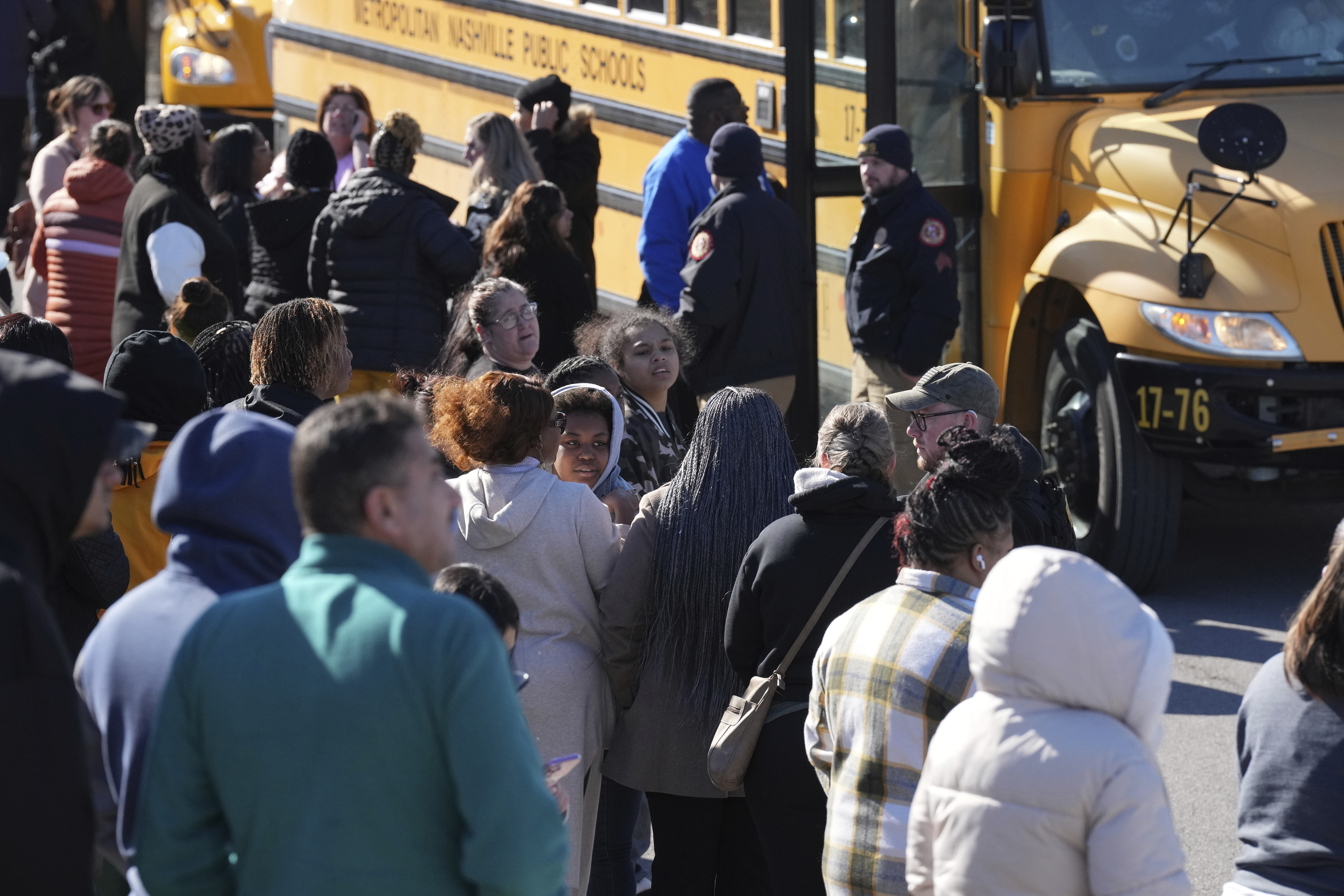 School buses arrive at a unification site following a shooting at the Antioch High School in Nashville, Tenn., Wednesday, Jan. 22, 2025. (AP Photo/George Walker IV)