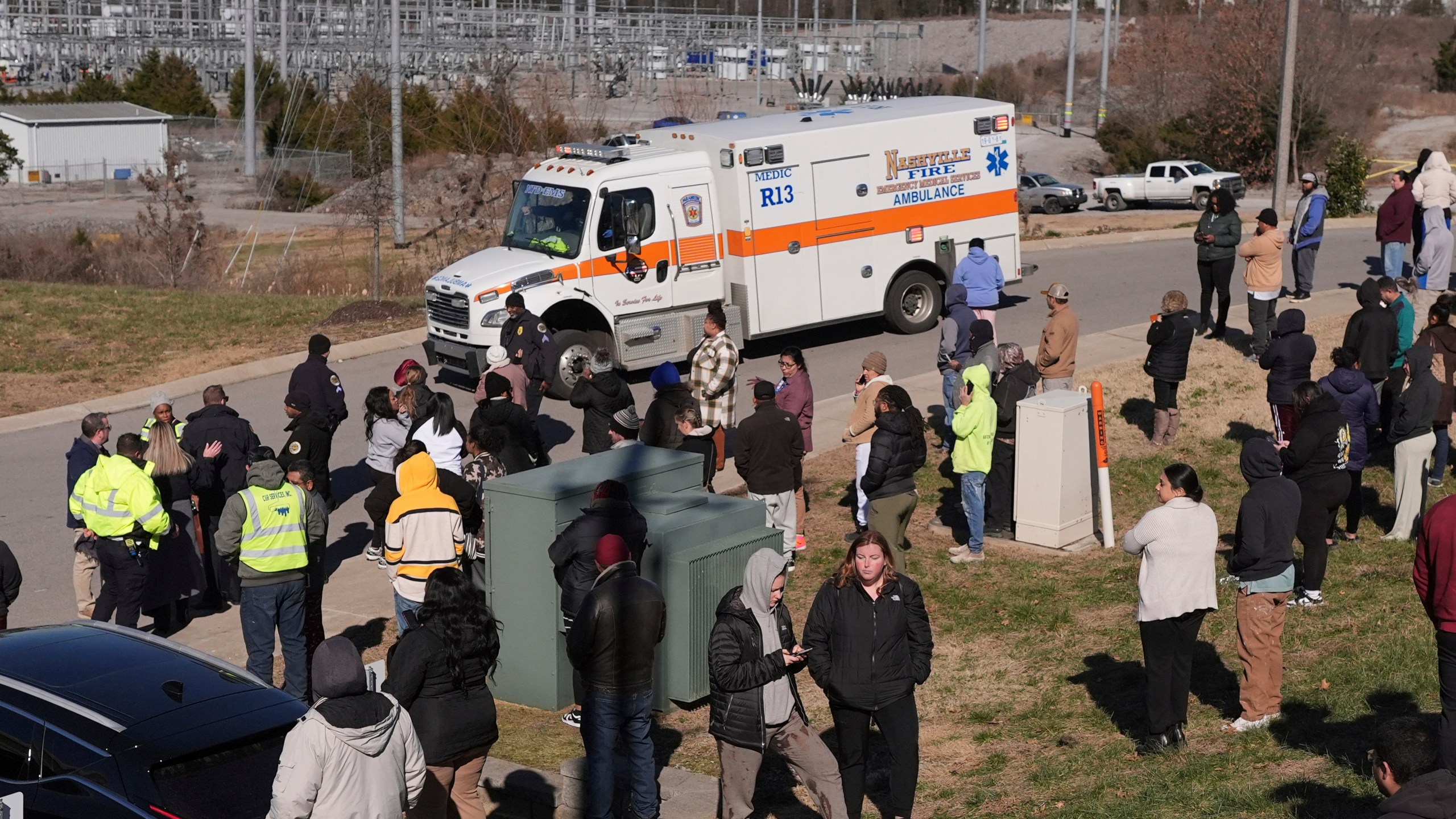 An ambulance leaves the Antioch High School following a shooting in Nashville, Tenn., Wednesday, Jan. 22, 2025. (AP Photo/George Walker IV)