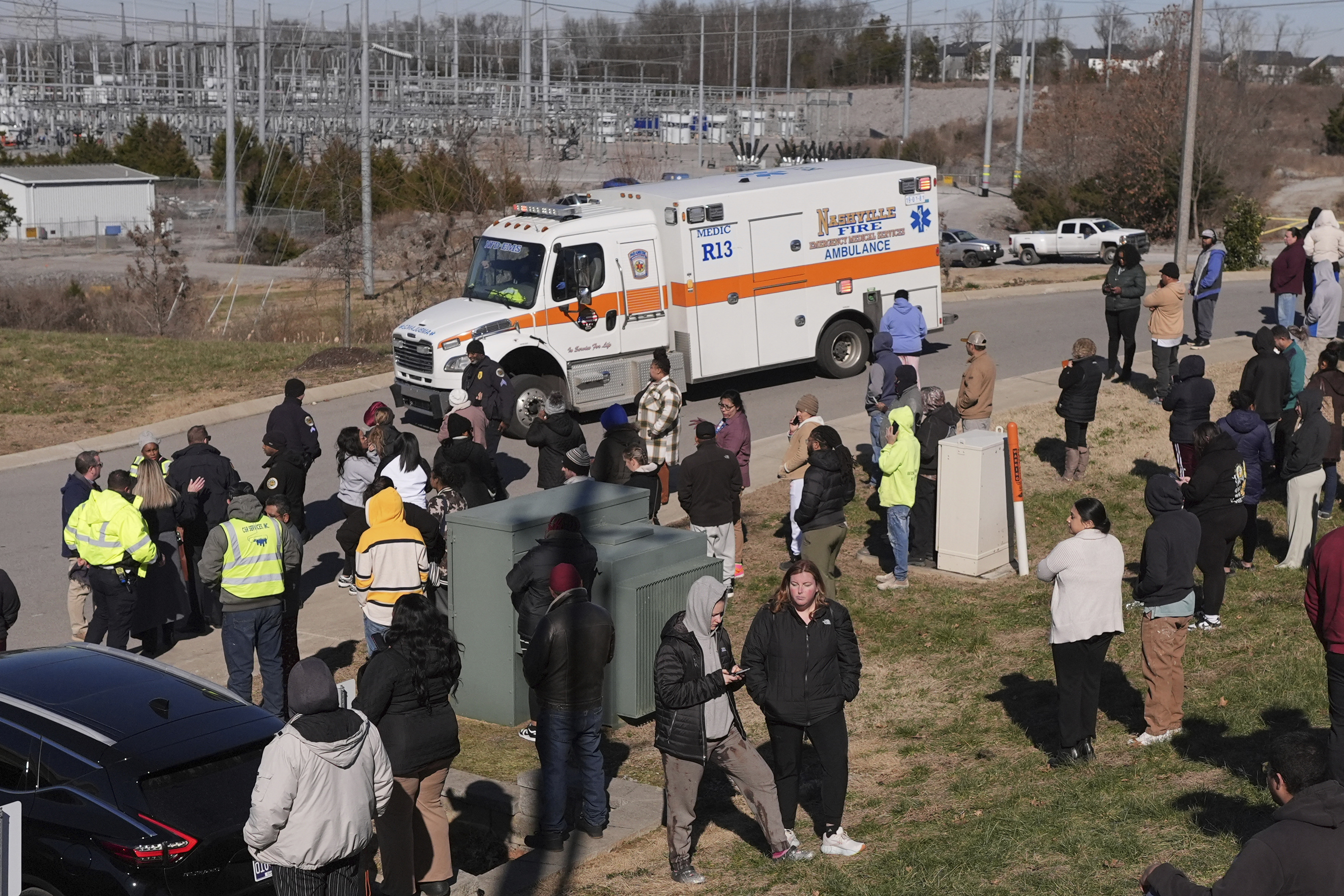 An ambulance leaves the Antioch High School following a shooting in Nashville, Tenn., Wednesday, Jan. 22, 2025. (AP Photo/George Walker IV)