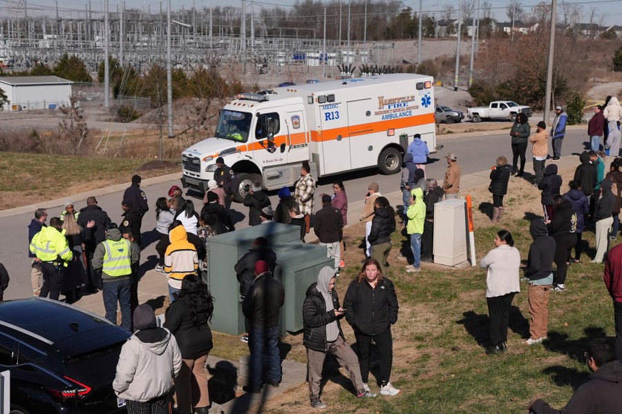 An ambulance leaves the Antioch High School following a shooting in Nashville, Tenn., Wednesday, Jan. 22, 2025. (AP Photo/George Walker IV)