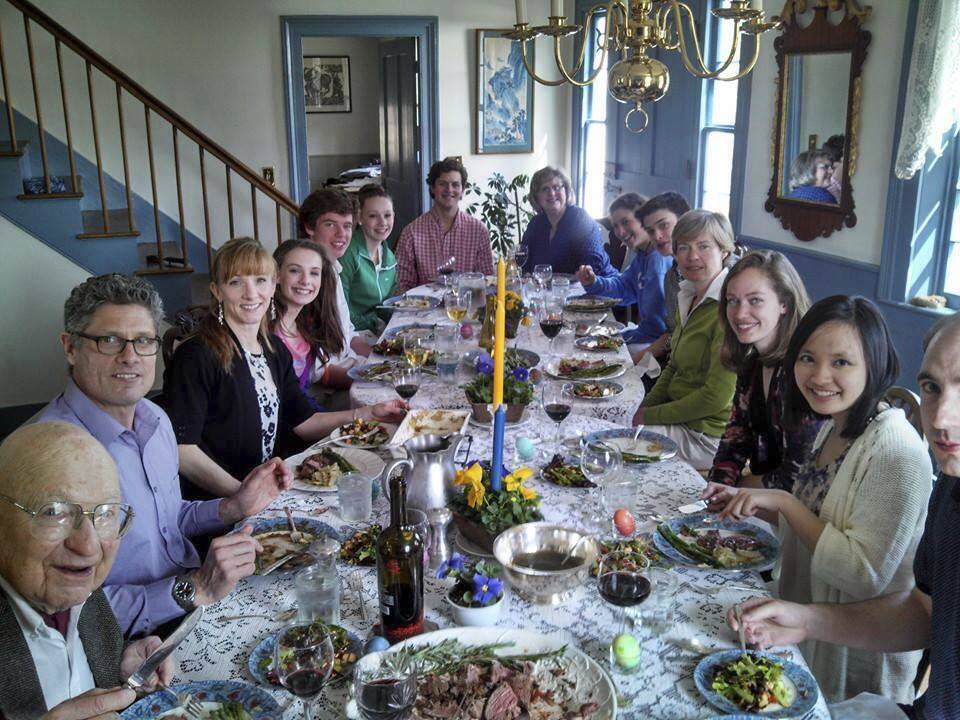 The Tecca family and friends celebrate Easter in 2014 in the dining room of their old house in Lyme, N.H., which burned down the following year. (Tecca family via AP)